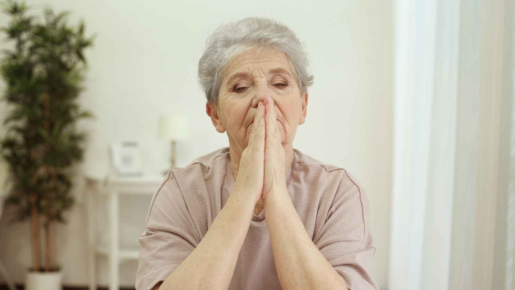 Older adult reflecting alone as psychology research explores regret, self-silencing, and living according to others’ expectations.