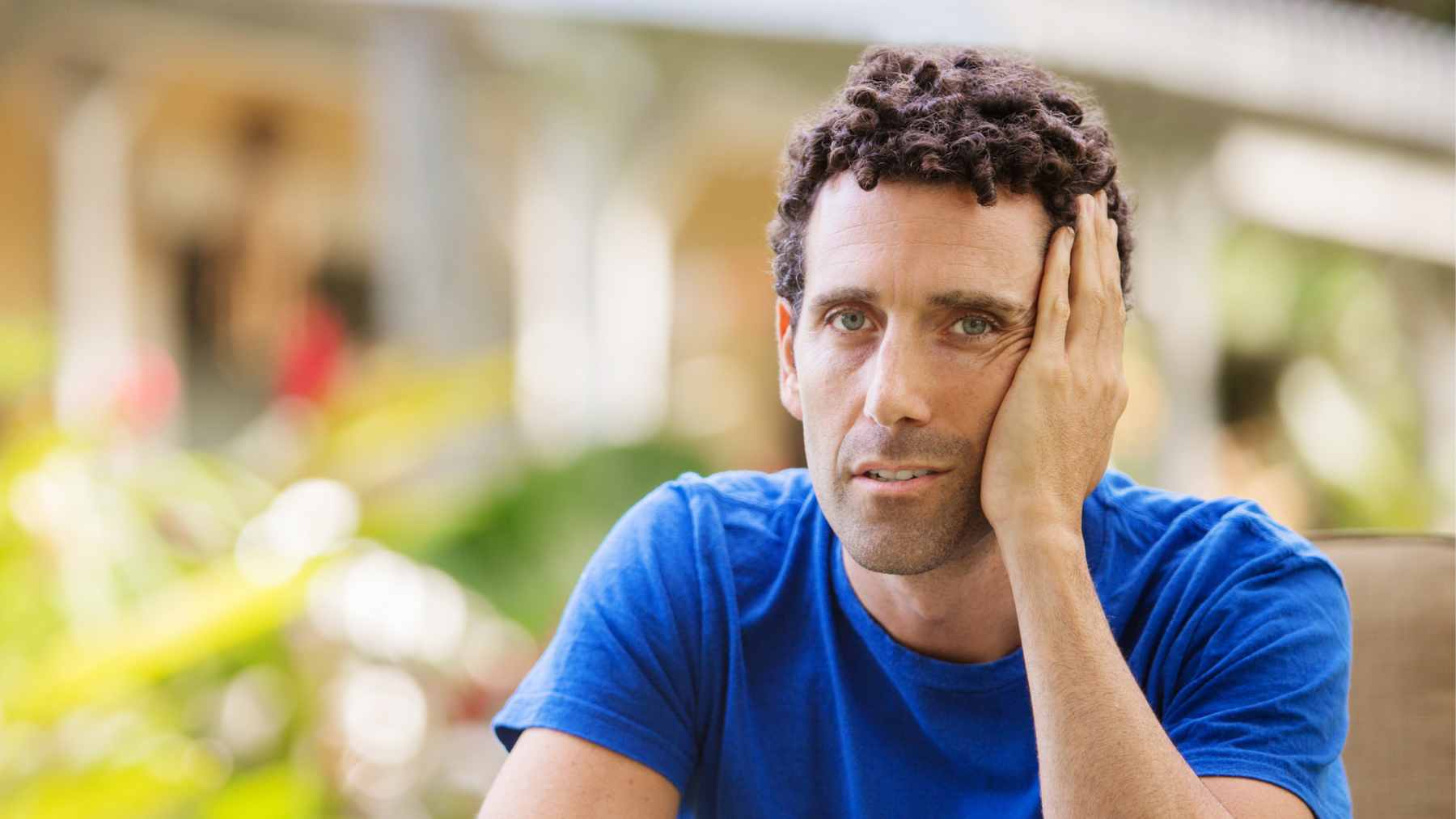 Two men in their 40s having a conversation over coffee, representing the importance of intentional social connection in midlife.