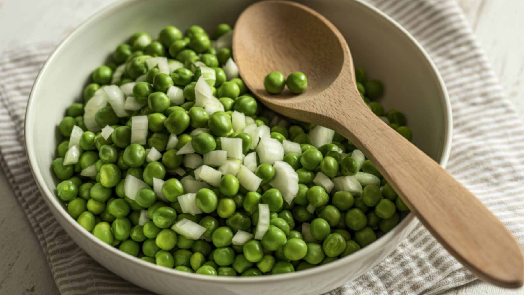 A bowl of fresh, vibrant green peas, showcasing their potential as a protein-rich and fiber-filled addition to daily meals.
