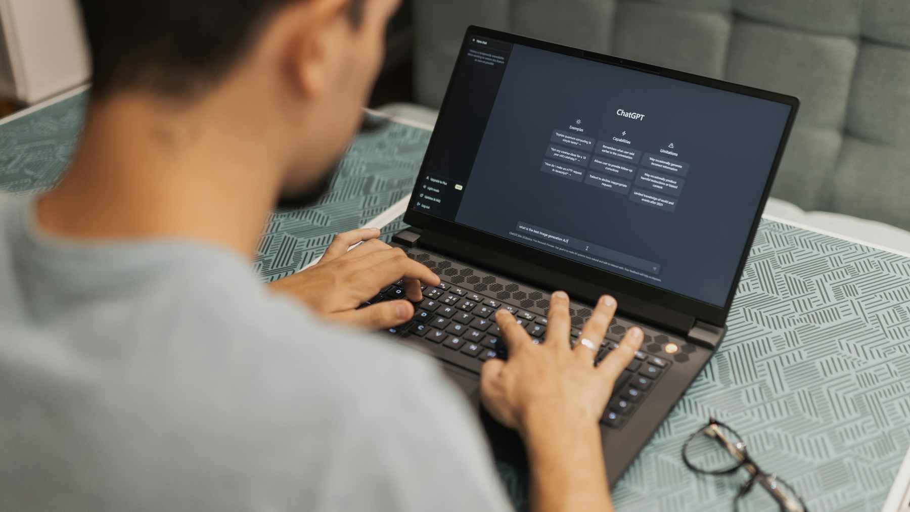 A person sitting in a dimly lit room using a smartphone to communicate with an AI chatbot, symbolizing the emotional risks of long-term digital interactions.