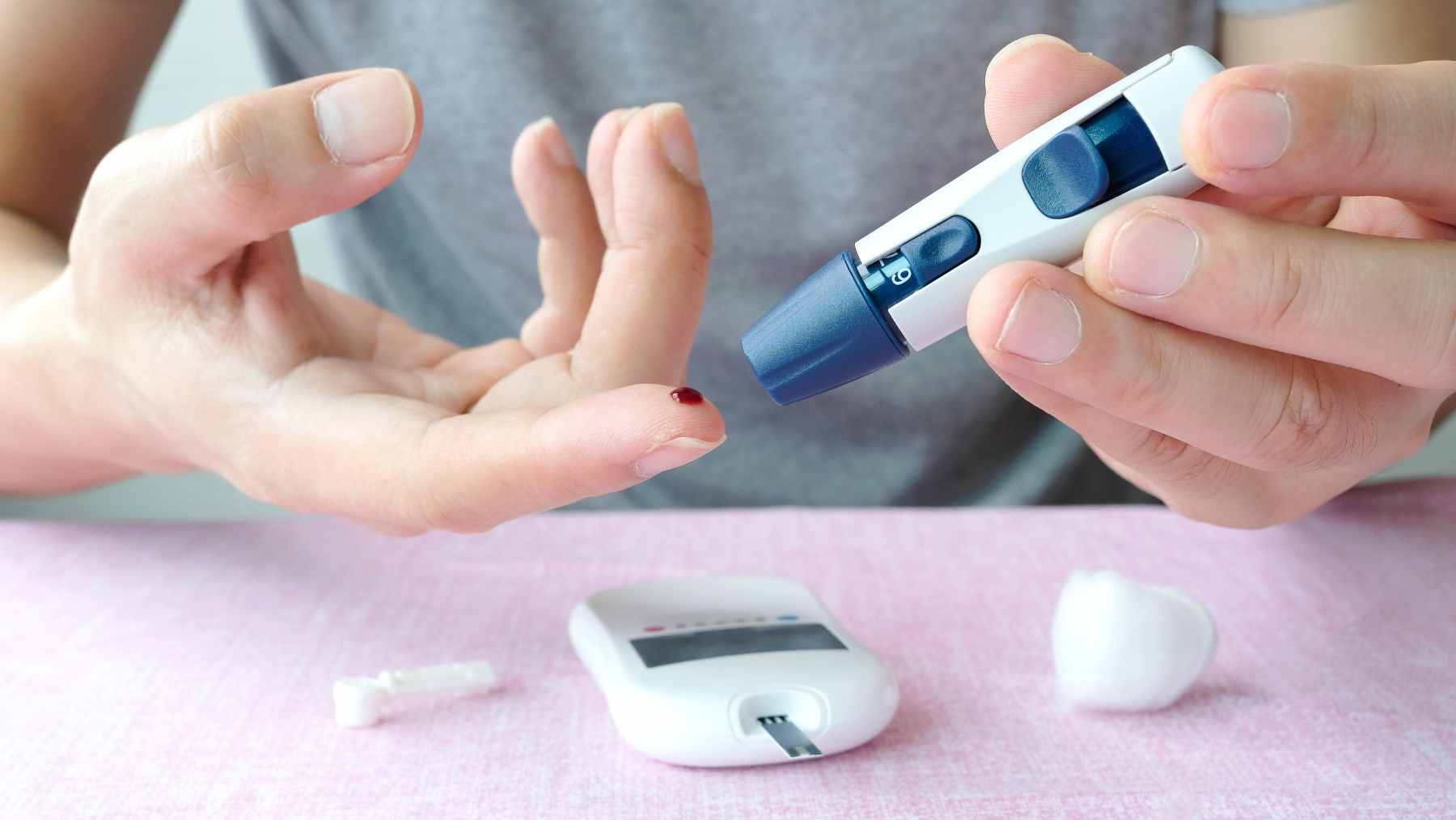 A medical professional discussing blood test results with a patient, highlighting the importance of screening for prediabetes.
