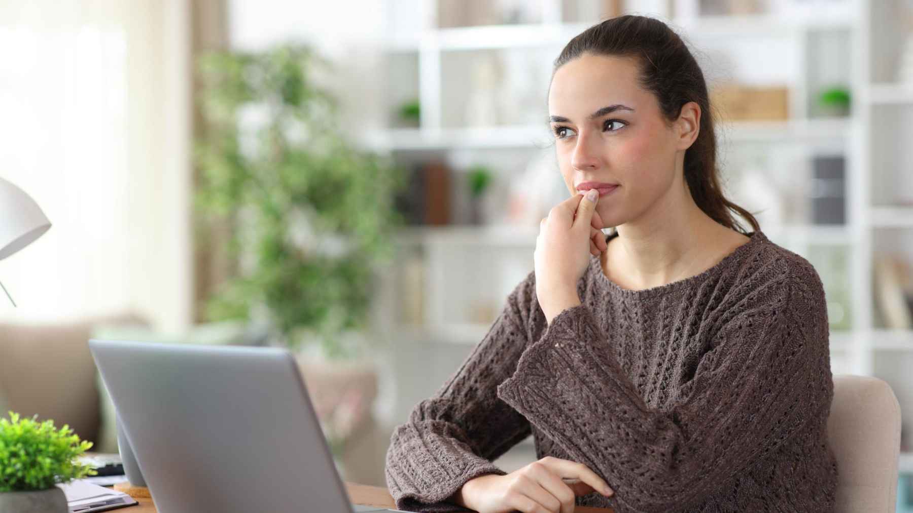 Person speaking quietly to themselves while organizing daily tasks, illustrating healthy self-talk, focus, and cognitive planning.
