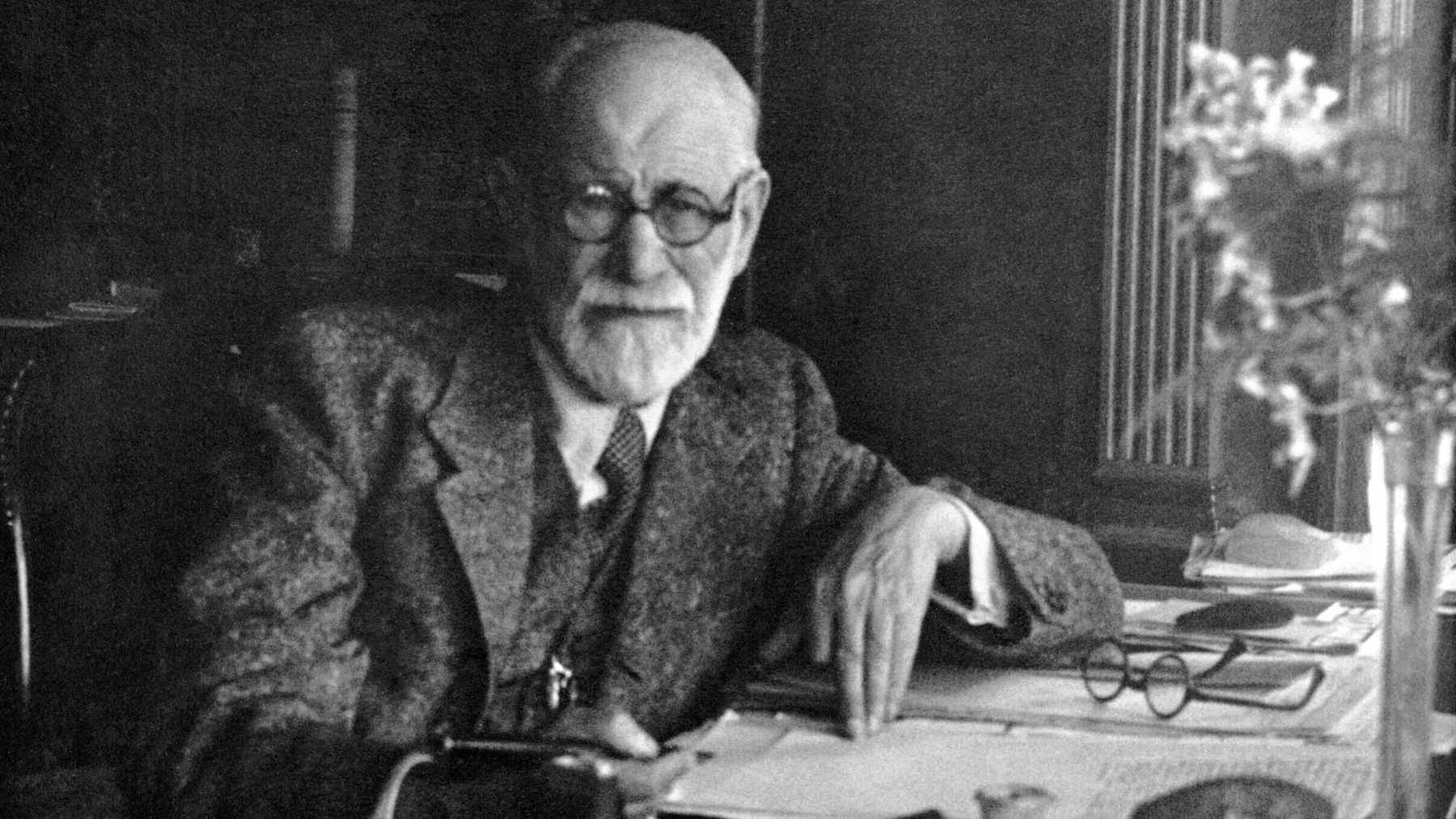 A vintage portrait of Sigmund Freud, the founder of psychoanalysis, looking thoughtful.