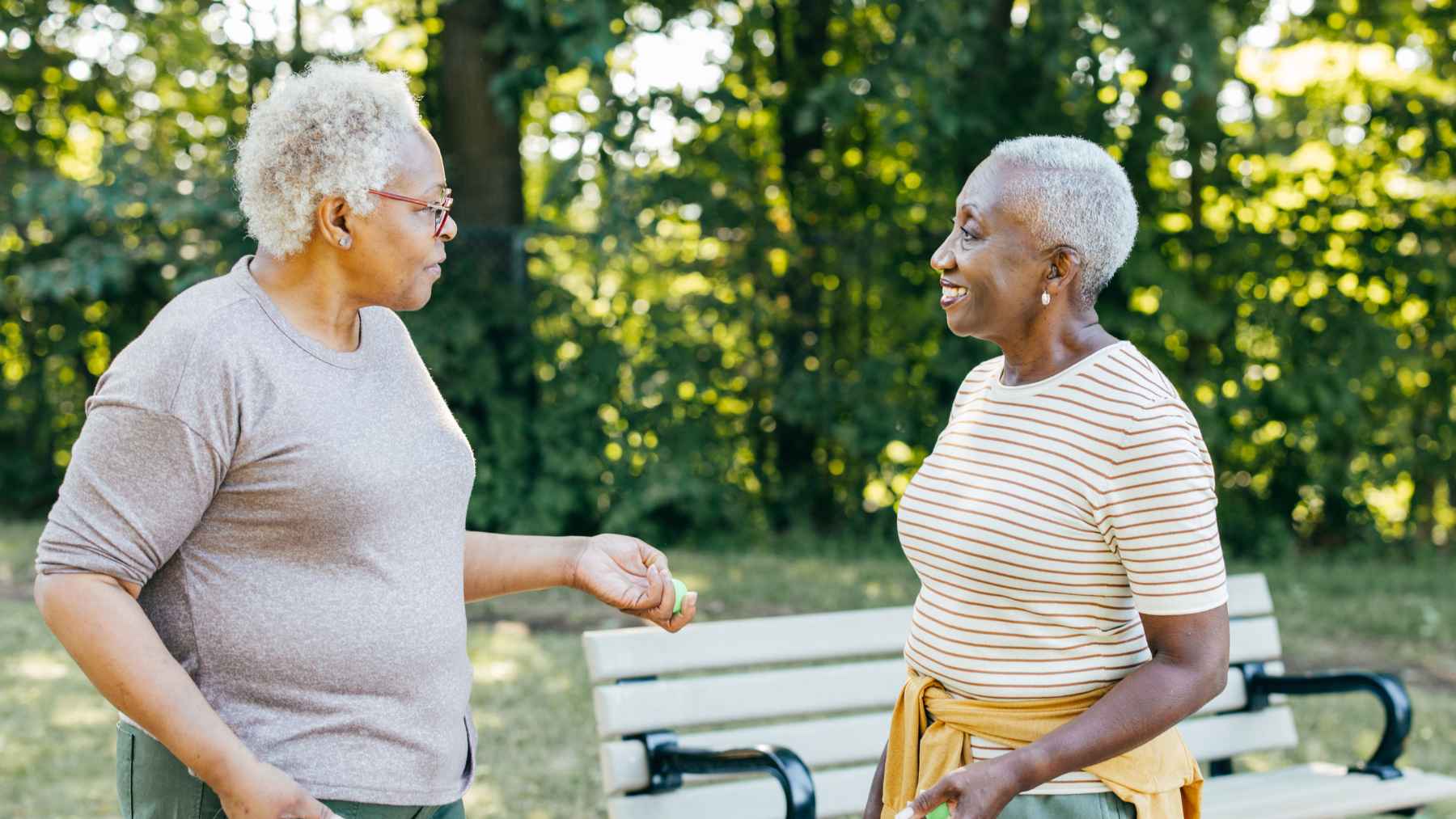 Older adult performing standing core exercises designed to strengthen abdominal muscles, improve balance, and support healthy aging.