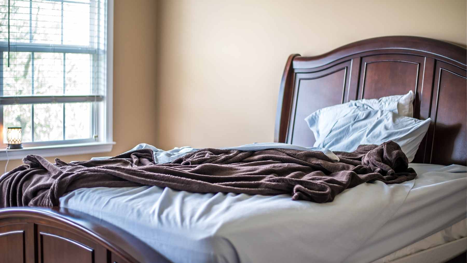 Leaving your bed unmade in the morning may not be laziness at all, and a psychologist says it can reveal 3 personality traits 1 A messy, unmade bed in a morning bedroom setting, suggesting a relaxed or spontaneous morning routine.
