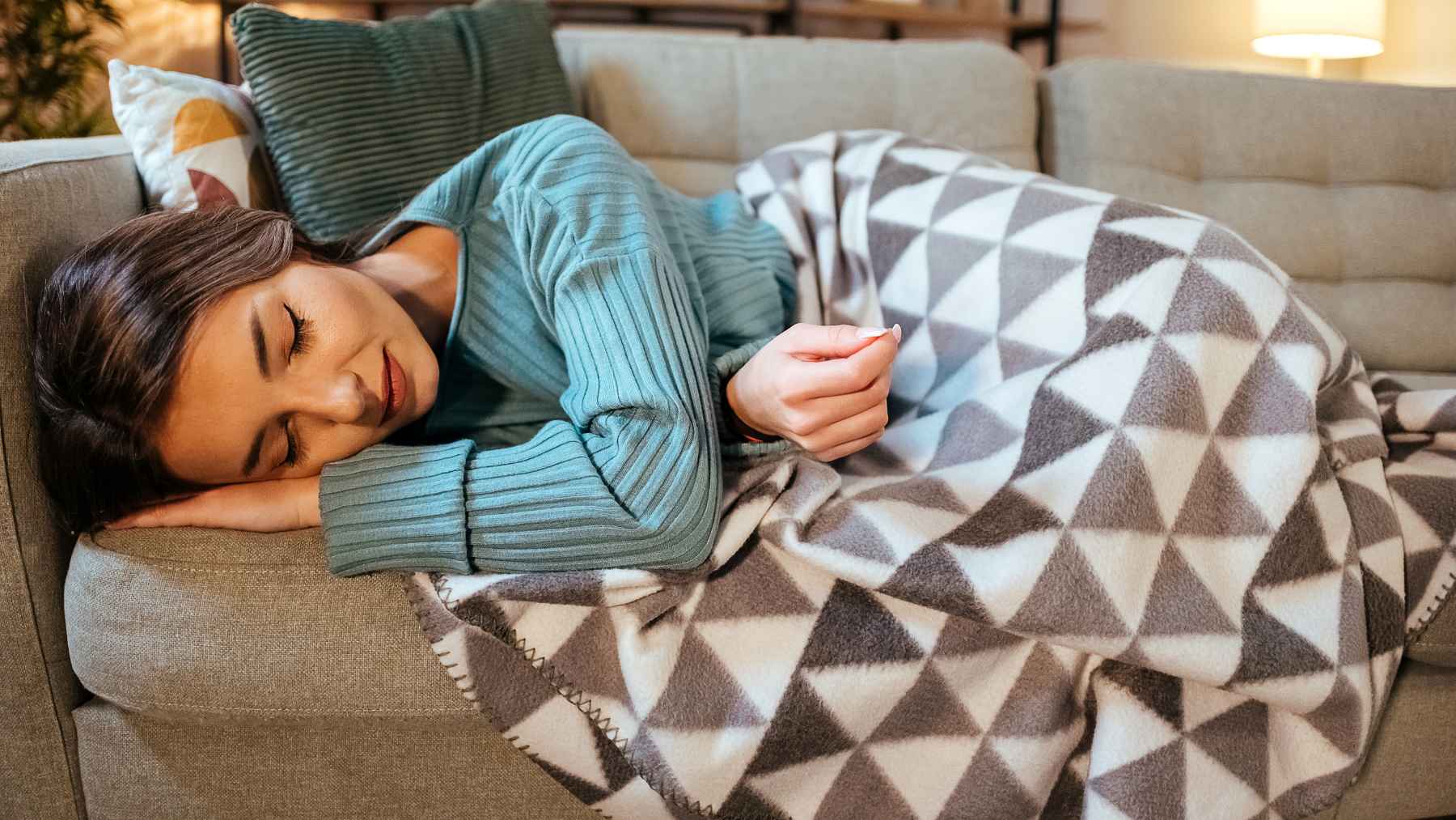 Person practicing the 4-7-8 breathing technique before bed to reduce anxiety and improve sleep quality.