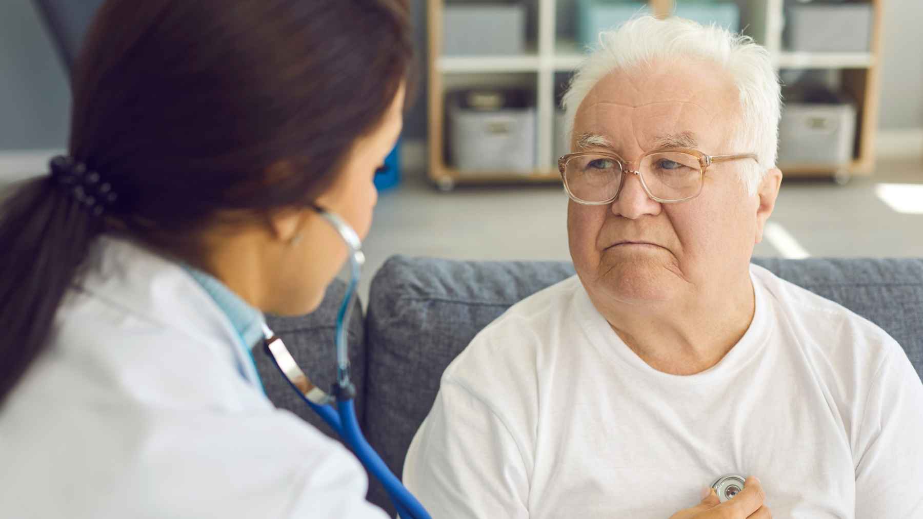 Healthcare professional reviewing medical data related to biological aging and early-onset cancer risk in younger adults.