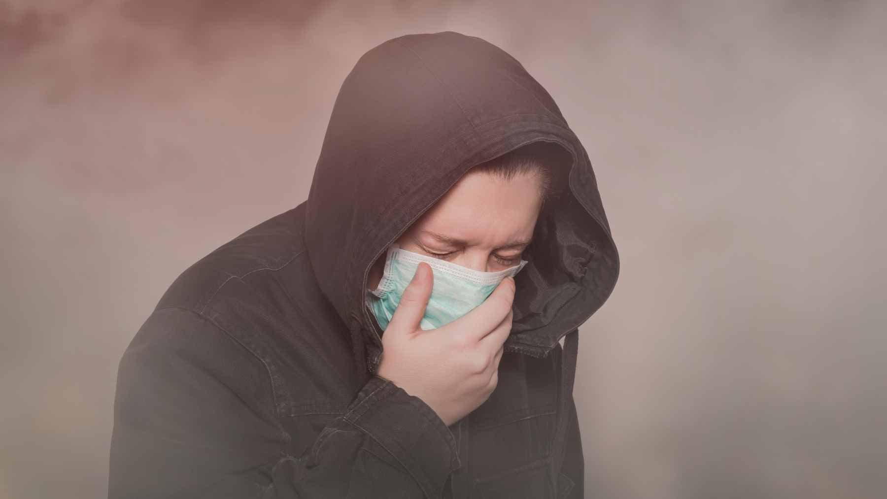 A hazy urban skyline under polluted air, representing the environmental exposure linked to increased risks of Parkinson's disease dementia and dementia with Lewy bodies in a major new study.