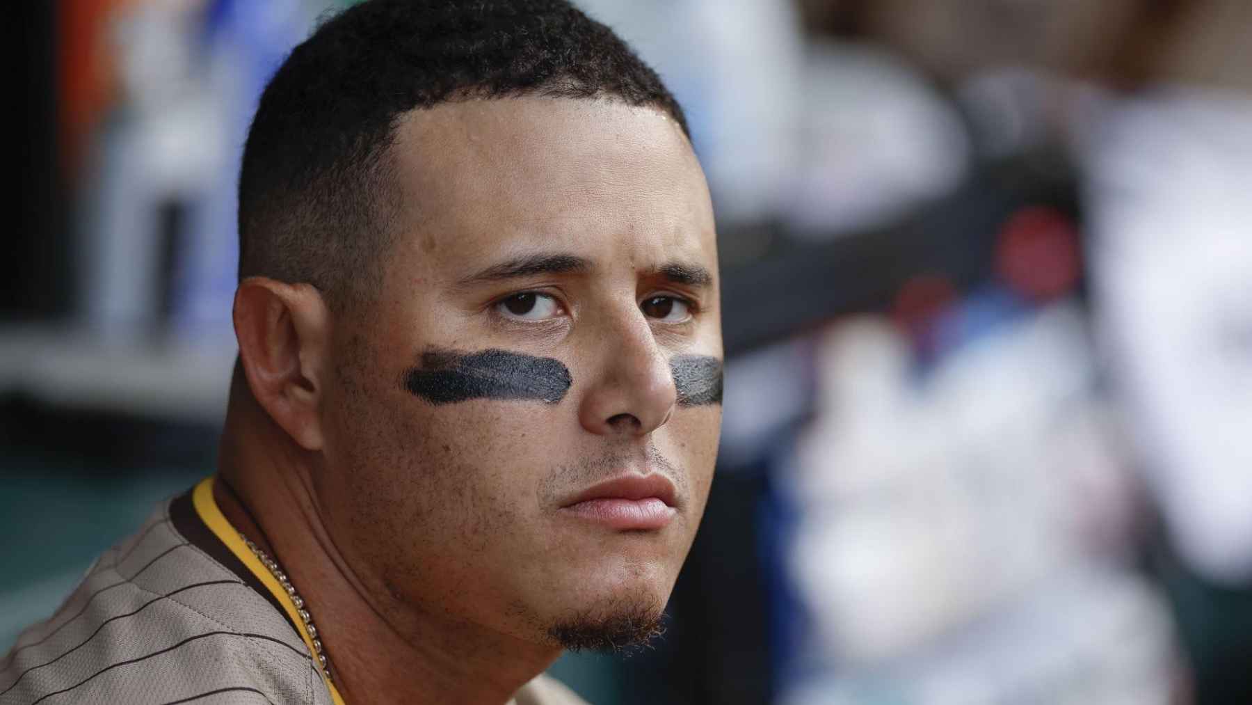 Close-up of a baseball player wearing black eye paint beneath both eyes before a game to help reduce glare and improve visual focus.