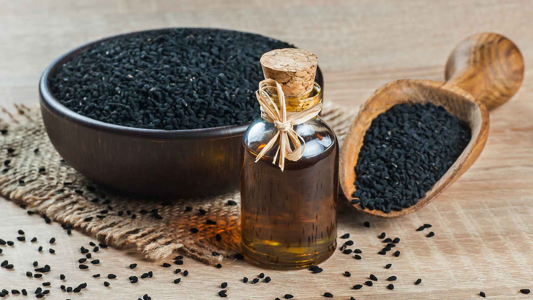 Close-up of black cumin (Nigella sativa) seeds, a spice studied for its potential to improve cholesterol levels and support metabolic health.