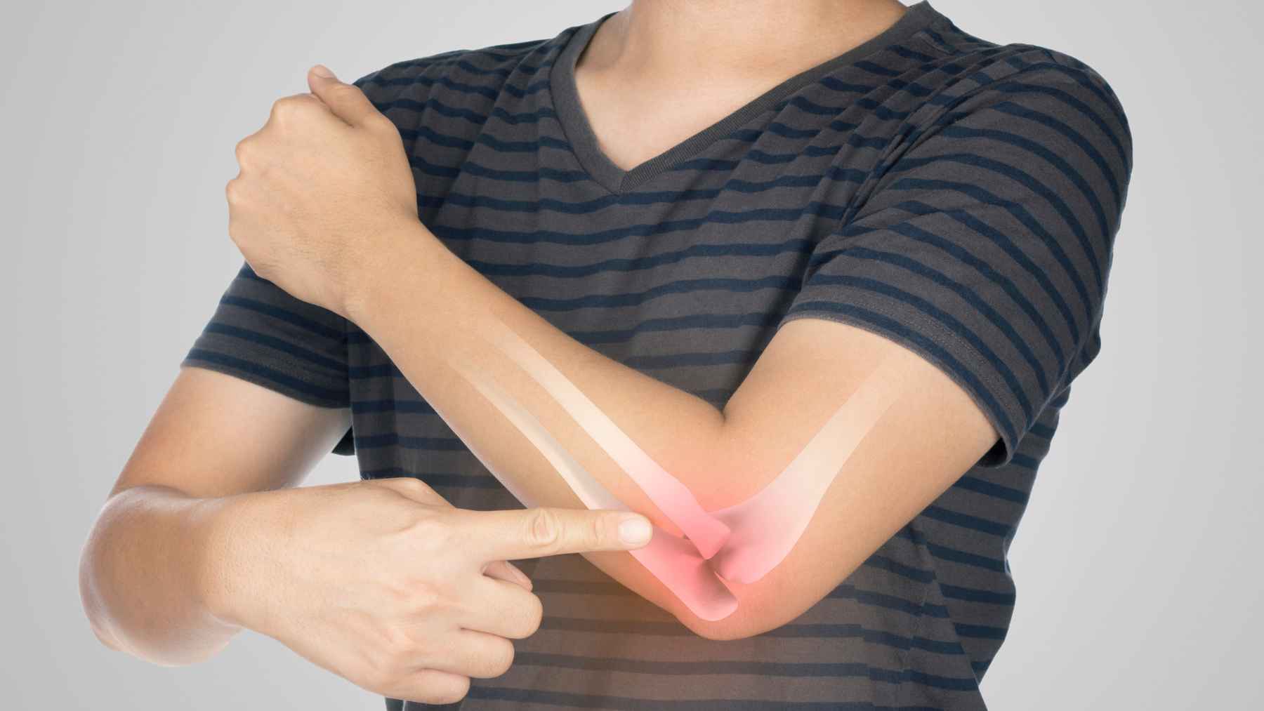 Person pointing to a painful elbow with a bone illustration, representing bone health, calcium, vitamin D, and fracture risk.