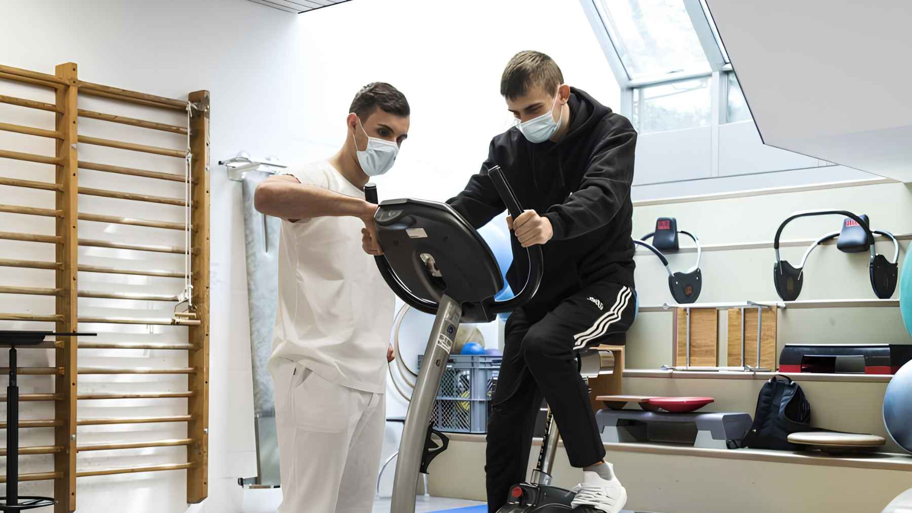 Cancer survivor exercises with a rehabilitation specialist during physical therapy to improve strength and manage post-treatment fatigue.