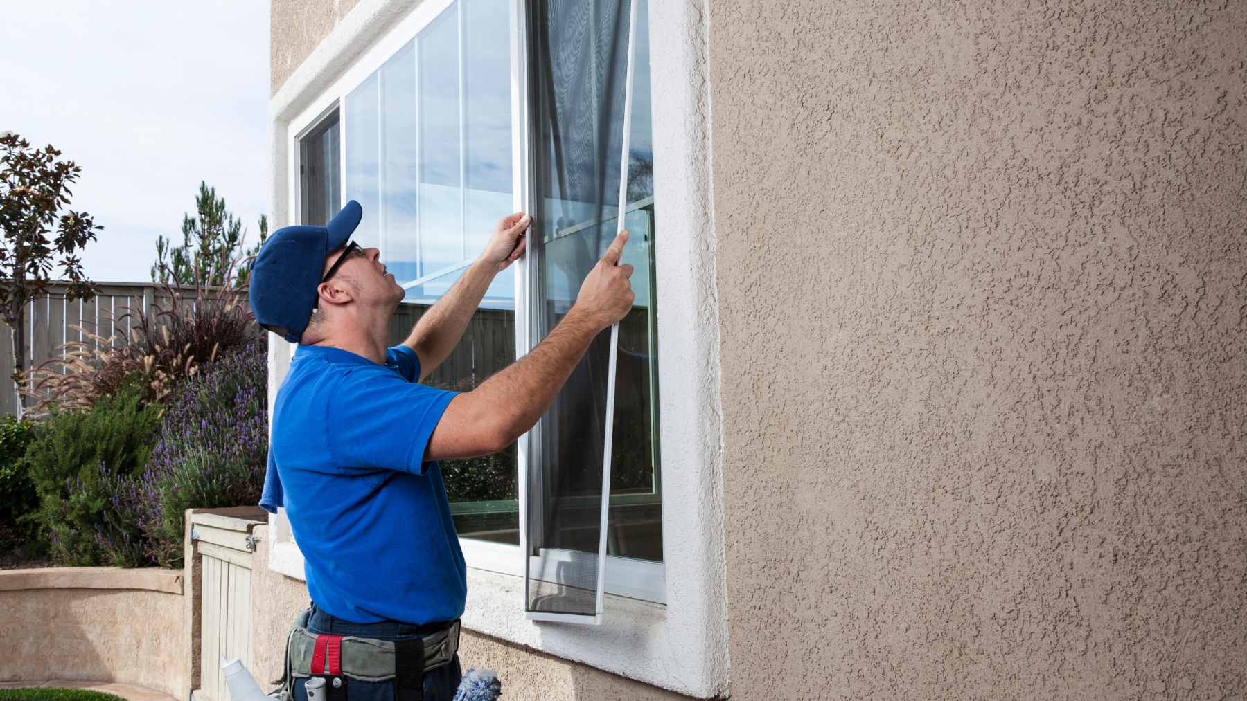 Your window screens are caked with dust and you never want to take them down, and there's a 5-minute trick that leaves them like new 1 A clean microfiber cloth being used to wipe a window screen while a towel protects the windowsill from drips.