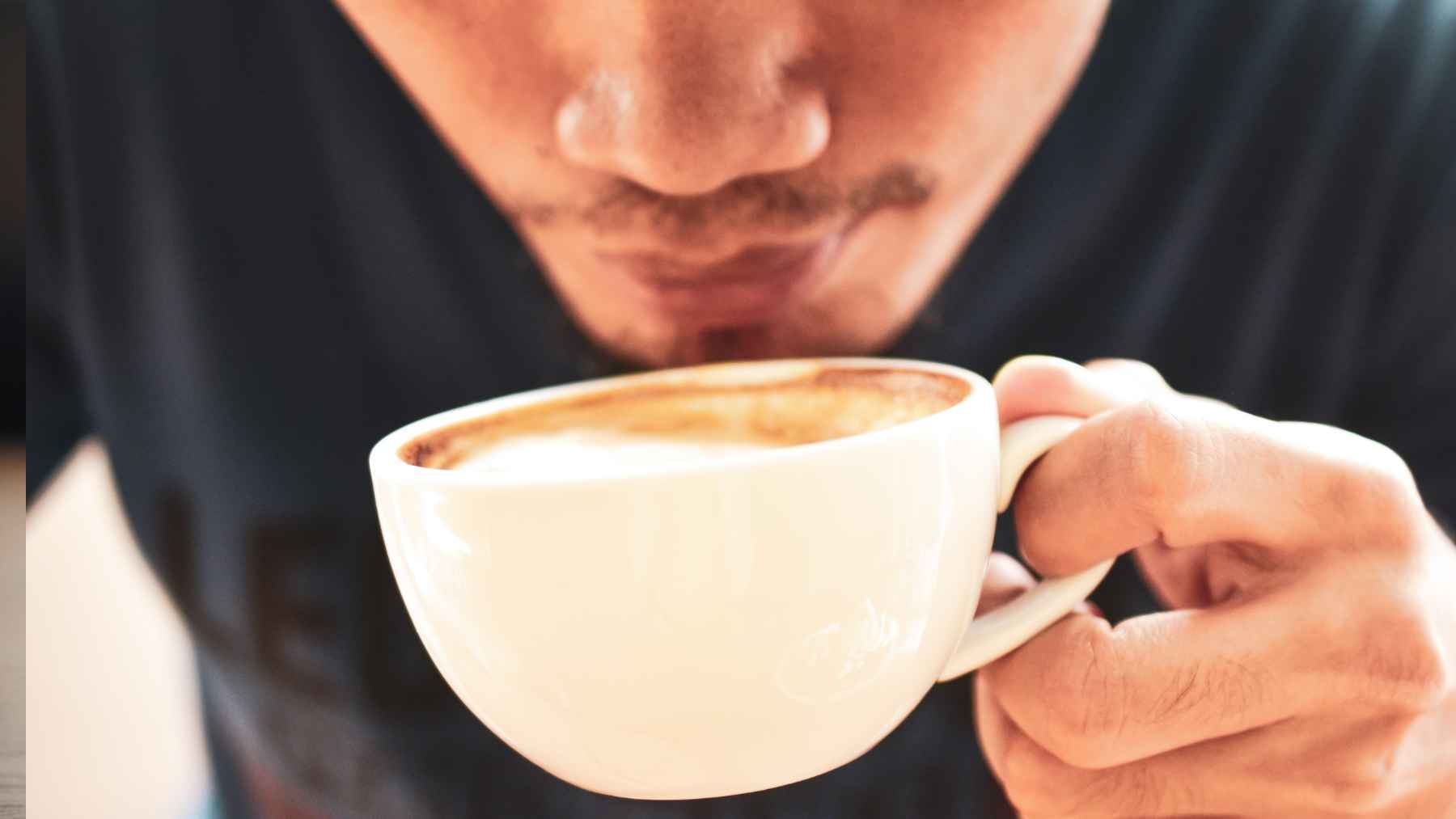 A fresh cup of coffee on a table, representing new research on coffee consumption and liver health.