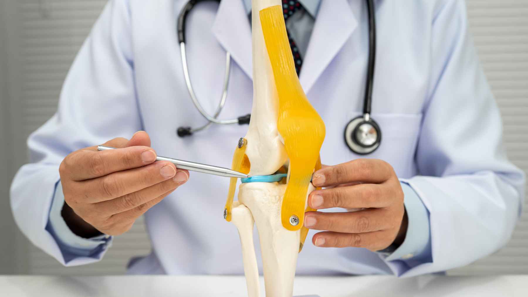 Doctors long said your worn joints can't heal, but a single injection may reverse osteoarthritis in weeks for a reason that surprised researchers 1 Doctor demonstrating a knee joint model while explaining experimental regenerative therapy for osteoarthritis and cartilage repair.