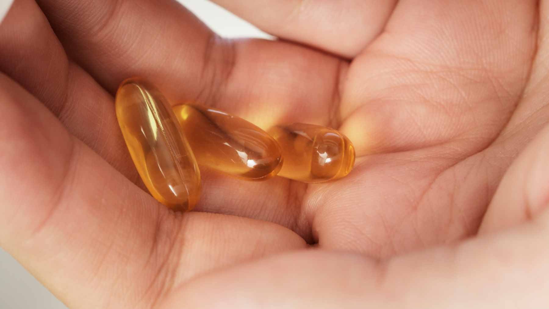 It's not the fish oil pill that protects you from dementia–a new study reveals the one thing that actually matters for your brain 2 A bottle of omega-3 fish oil supplements sitting on a table, highlighting the common but unproven use for Alzheimer’s prevention.