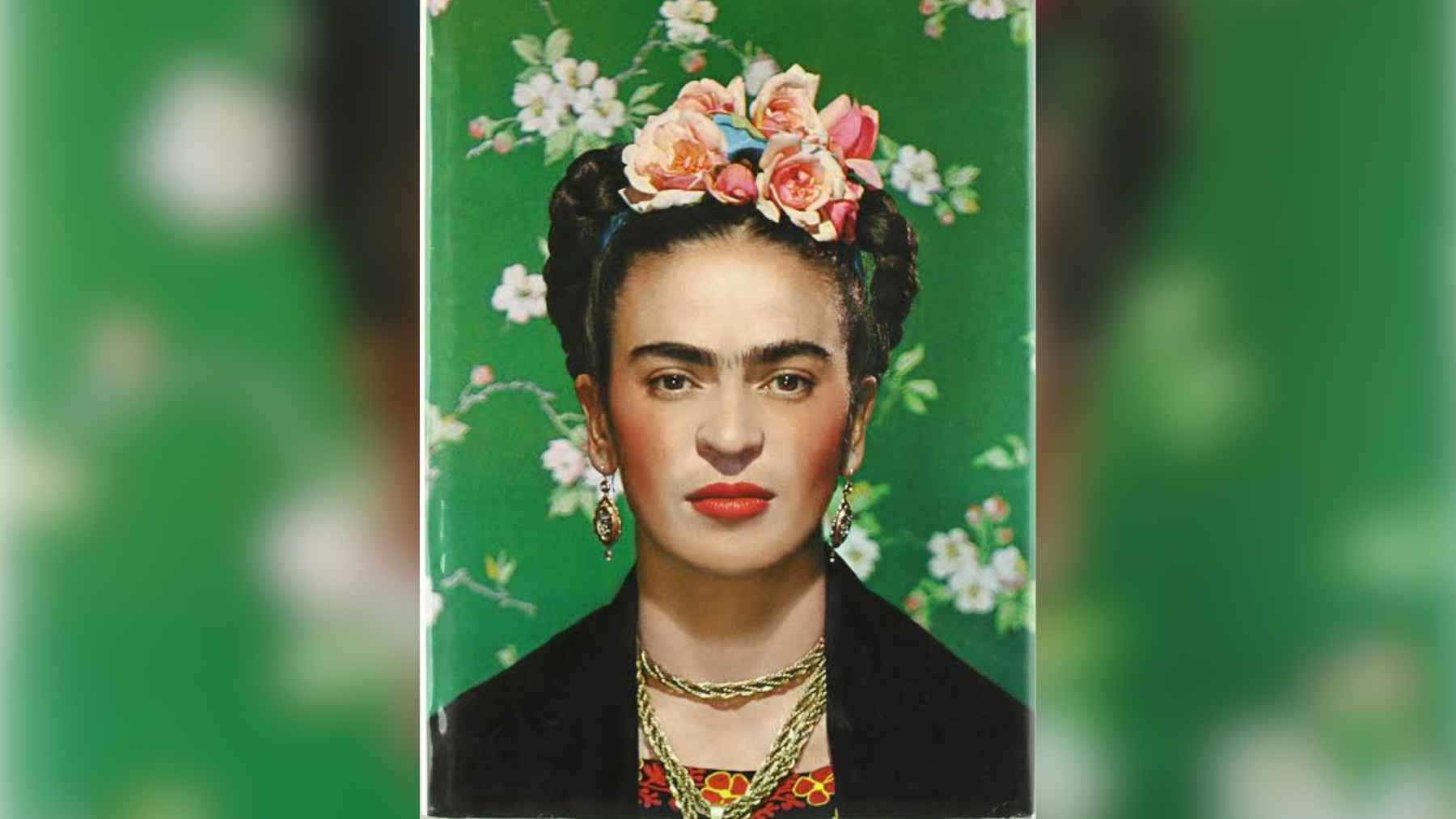 A portrait of Mexican painter Frida Kahlo surrounded by vibrant flowers and botanical elements.
