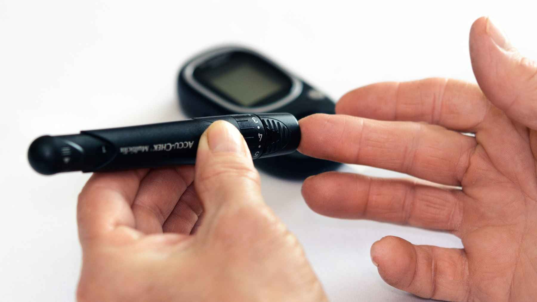 A patient reviewing medical test results with a doctor, representing treatment options for diabetes and atrial fibrillation.