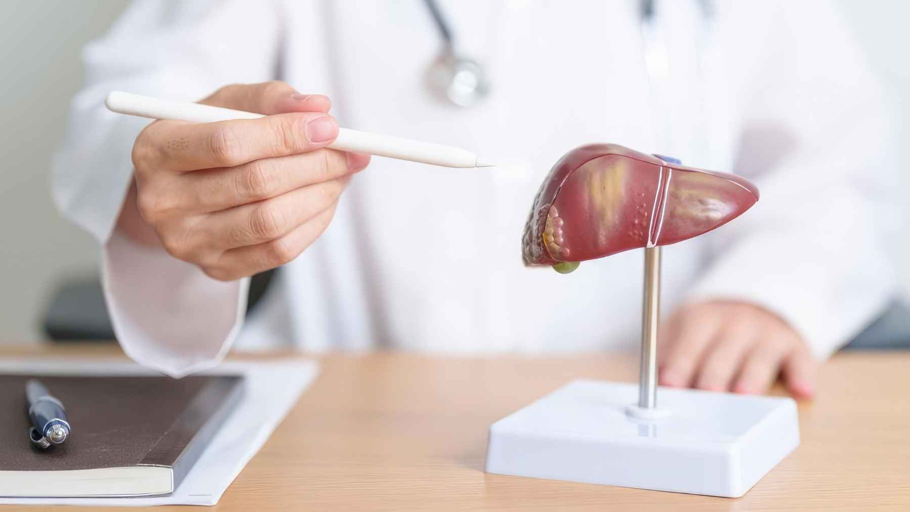 Healthy foods alongside fresh vegetables and water, illustrating dietary choices that support liver health and help reduce the risk of fatty liver disease.