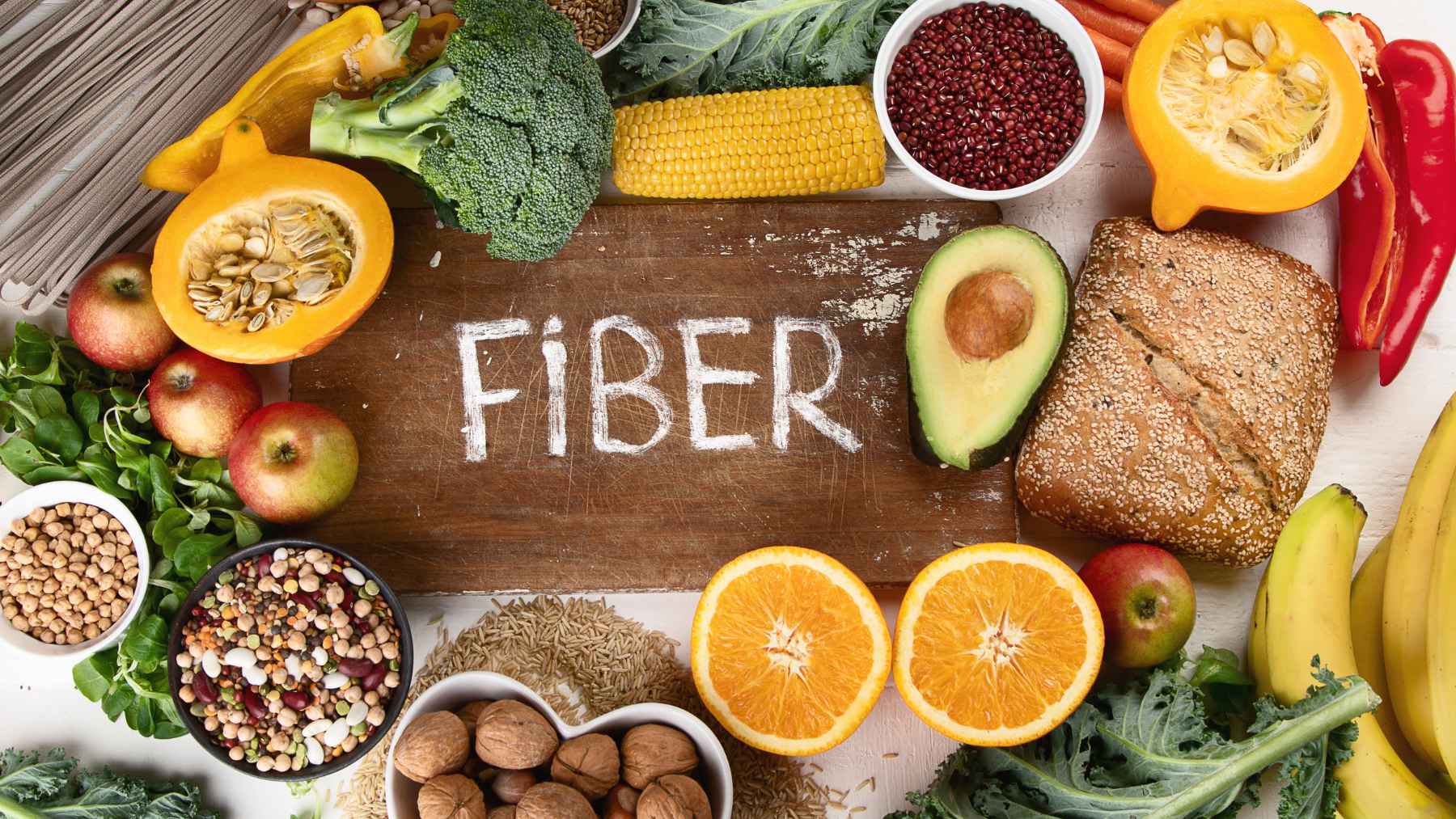 You are probably falling short on fiber, quietly missing better blood sugar, sharper gut health, but four simple swaps could fix that 1 A variety of high-fiber foods including whole grains, legumes, fruits, vegetables, nuts, and seeds arranged around a fiber display.