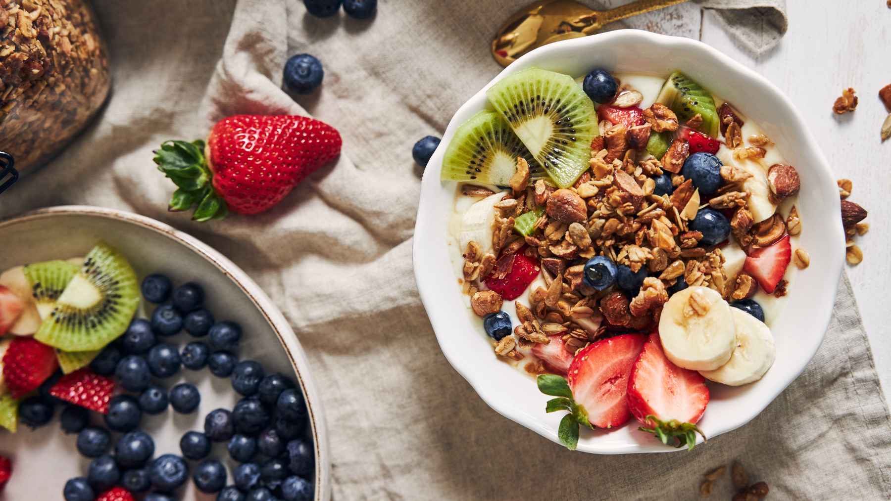Selection of protein-rich whole foods including Greek yogurt, beans, cottage cheese, seeds, lean meat, and edamame for healthy meals.