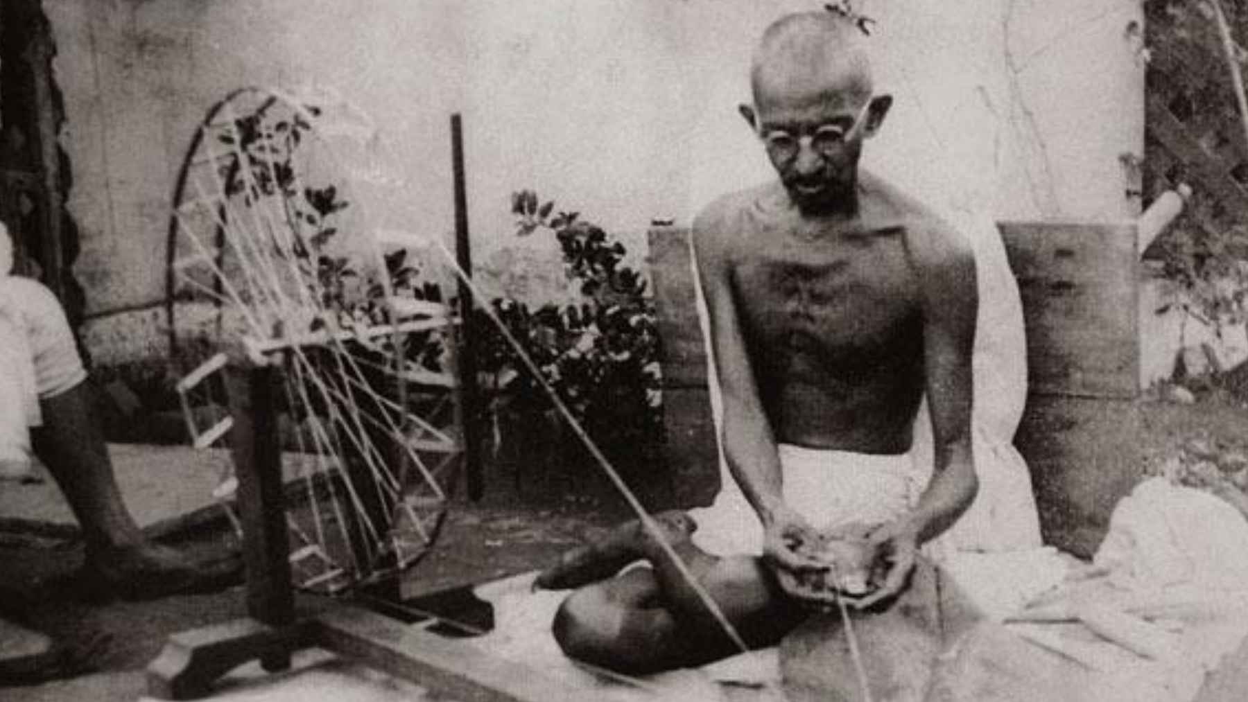 Portrait of Mahatma Gandhi, whose philosophy connected lasting happiness with harmony between thoughts, words, and actions.