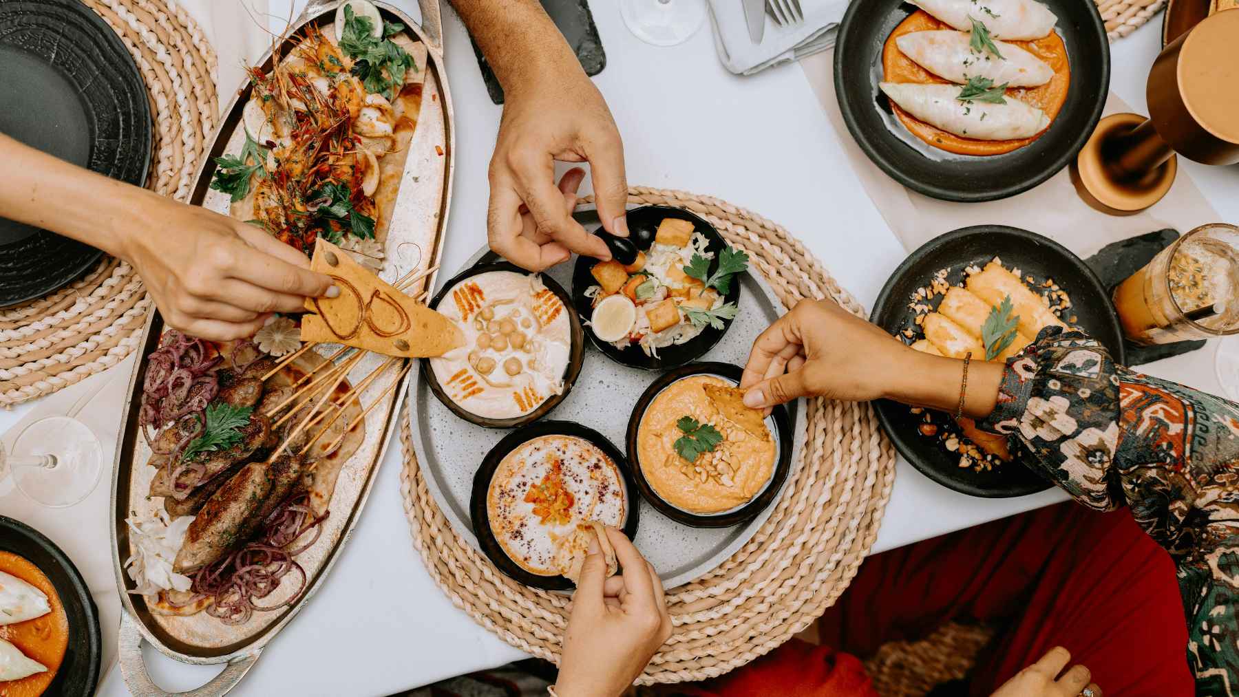 Mediterranean-style meals arranged to match morning and evening chronotypes, illustrating how meal timing may support metabolism and overall health.