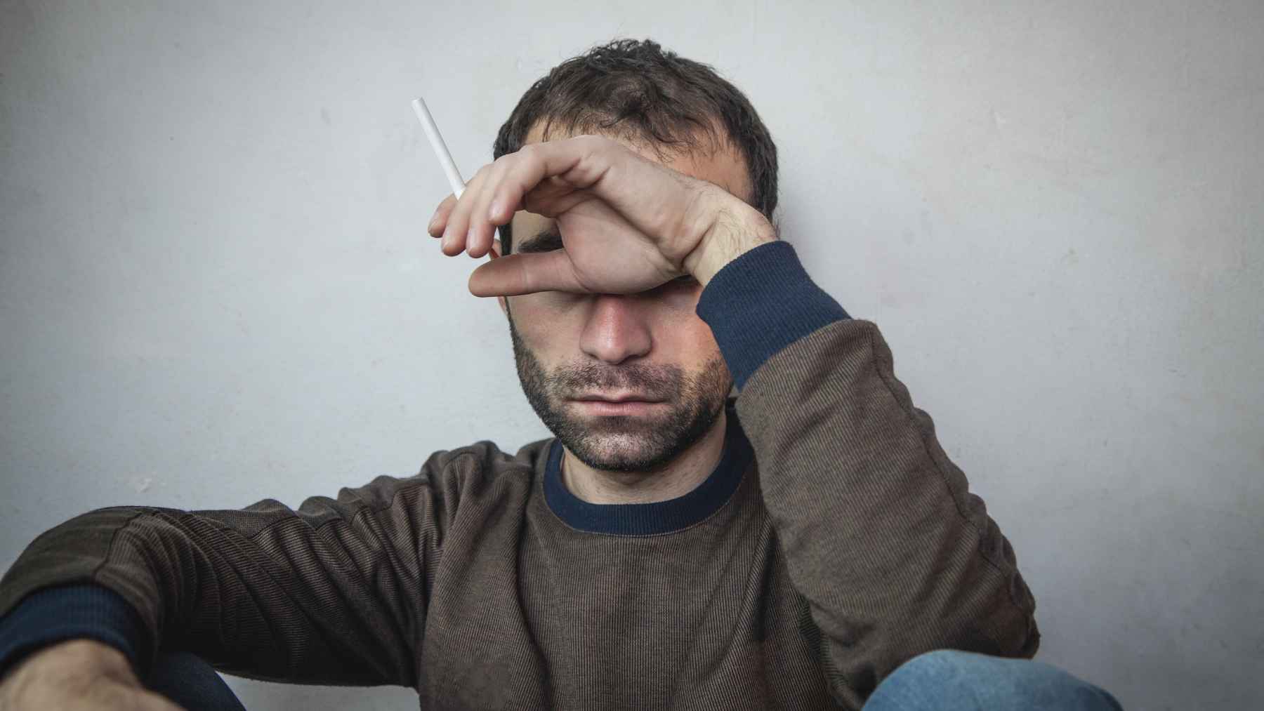 Men participating in a mental health support group led by professionals, encouraging open conversations, emotional well-being, and peer support.