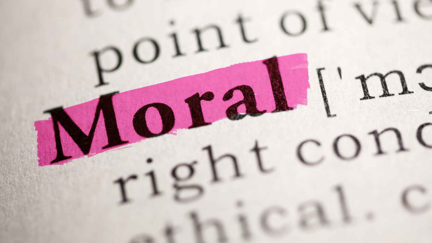 Immanuel Kant, German philosopher: "A man's dignity lies in his capacity to hold to his own moral principles" 1 The word "moral" highlighted in a dictionary, representing ethics, moral principles, and responsible decision-making.