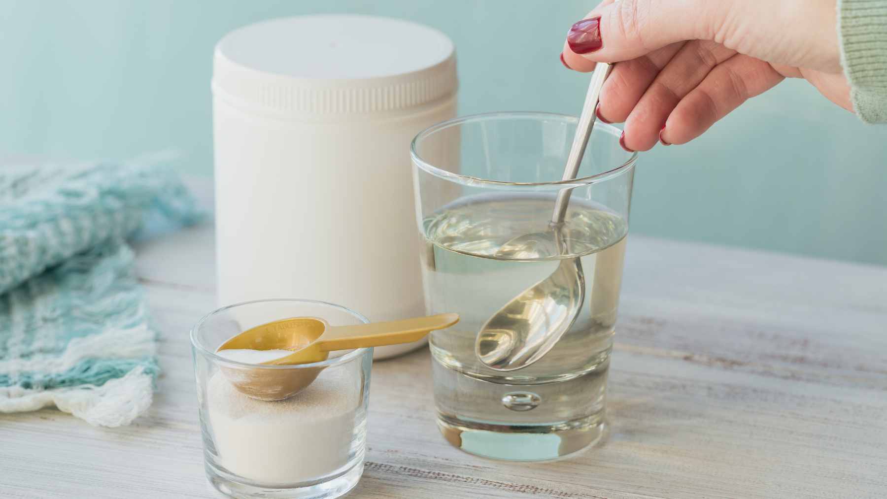 A selection of supplement bottles including omega-3, magnesium, and collagen displayed alongside healthy food options.