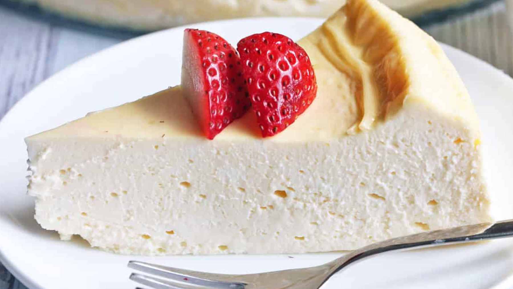 This keto cheesecake works every single time and tastes like a holiday classic, and the reason it never fails is simpler than you think 2 A beautifully sliced keto cheesecake featuring a distinct bottom layer of poppy seeds and nuts topped with a smooth, creamy cheese filling.