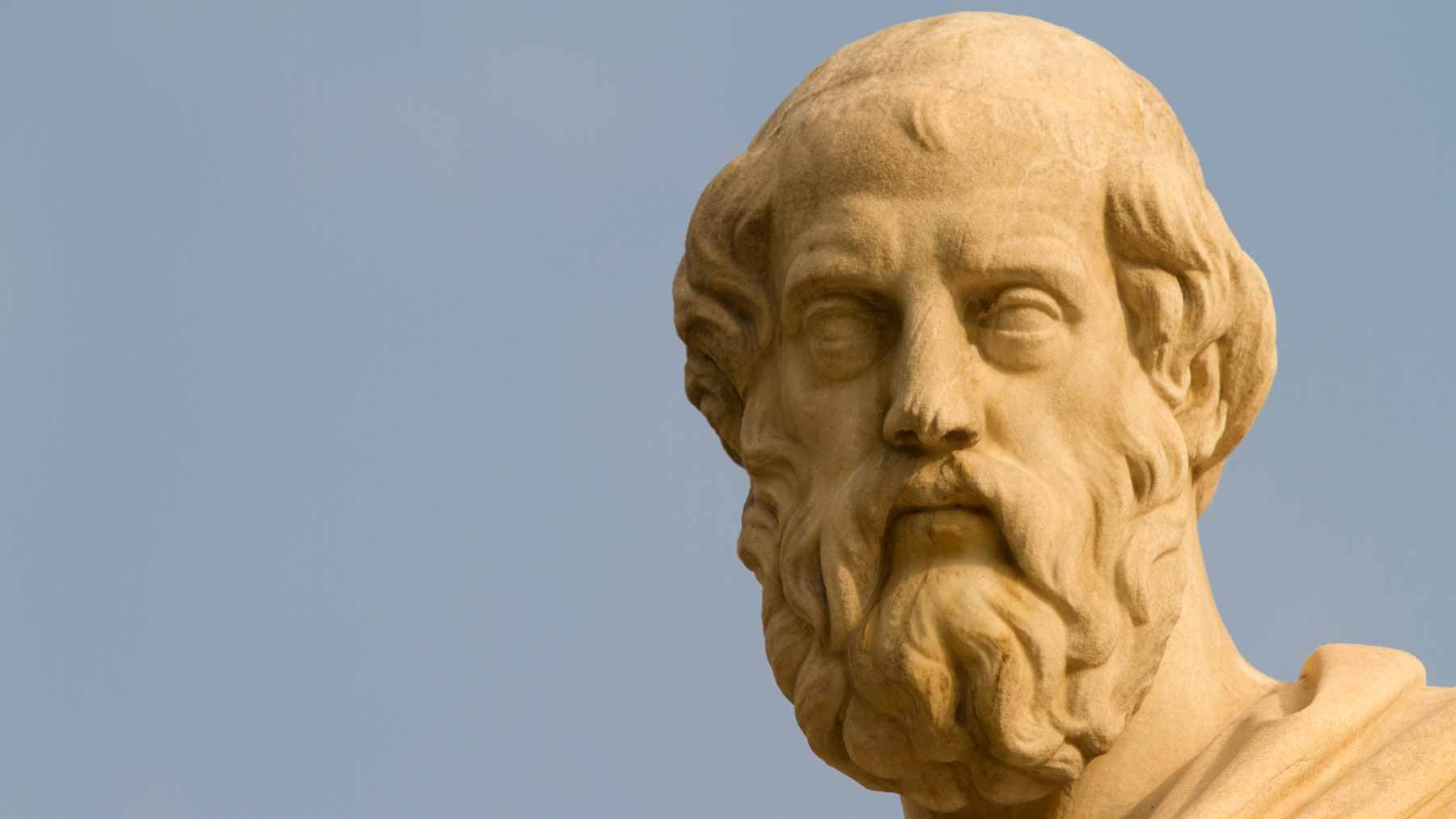 A classic bust of Plato, symbolizing the timeless philosophical pursuit of wisdom and the value of ongoing inquiry.