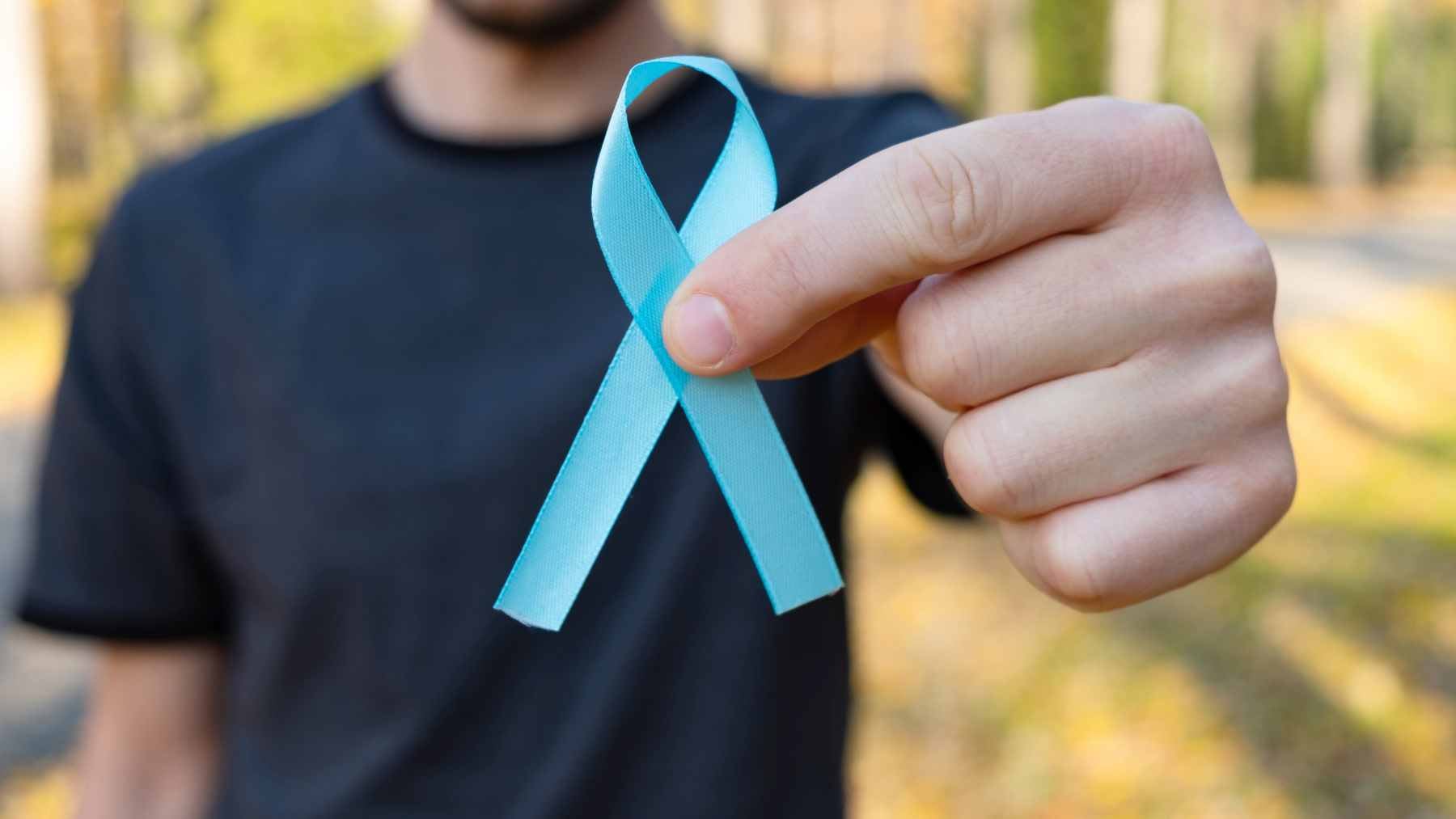A medical professional discussing health screenings with a patient, highlighting the importance of regular prostate checkups.