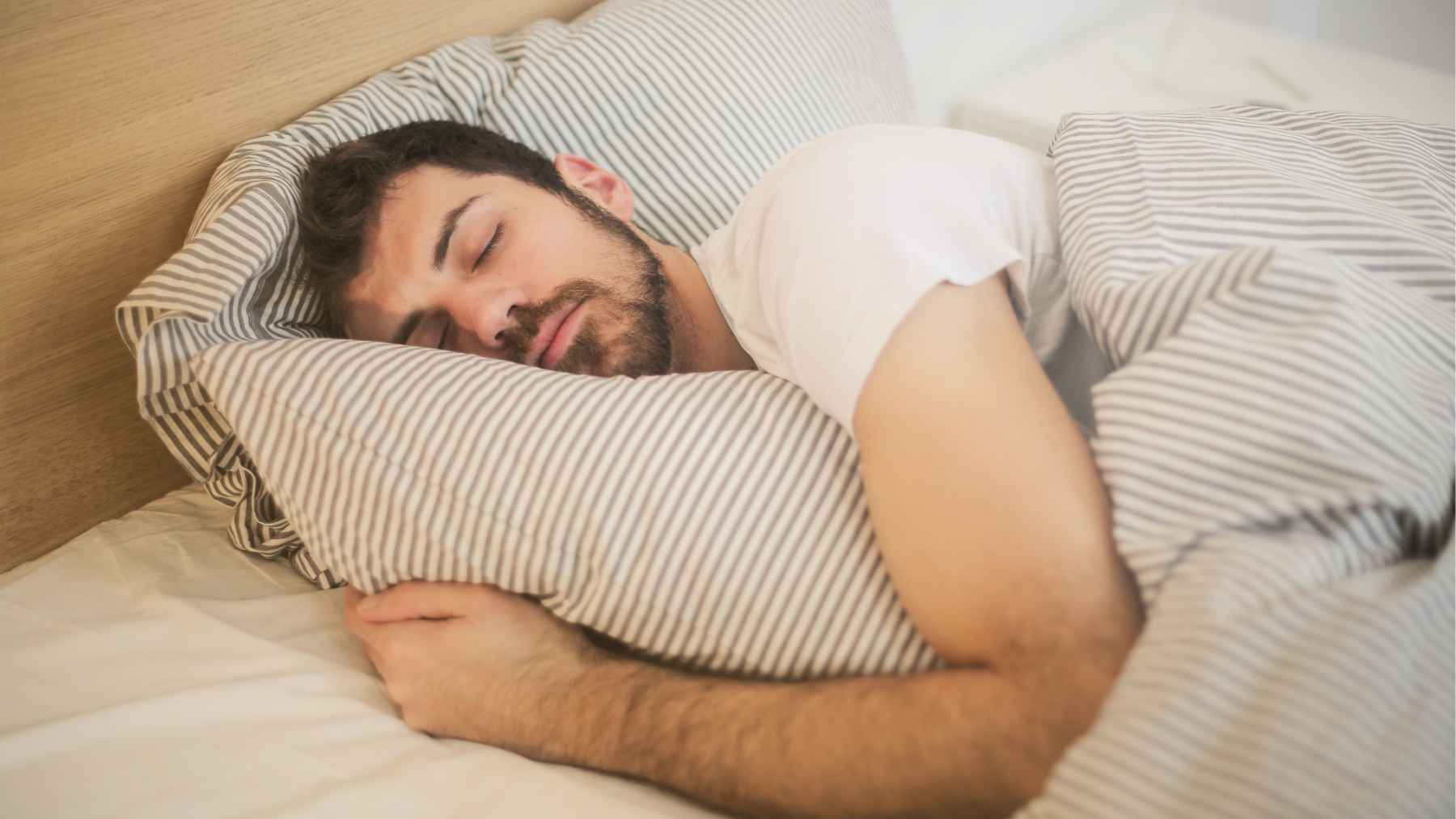 Person relaxing on a couch, illustrating prolonged sedentary behavior linked to higher cancer risk despite regular exercise.