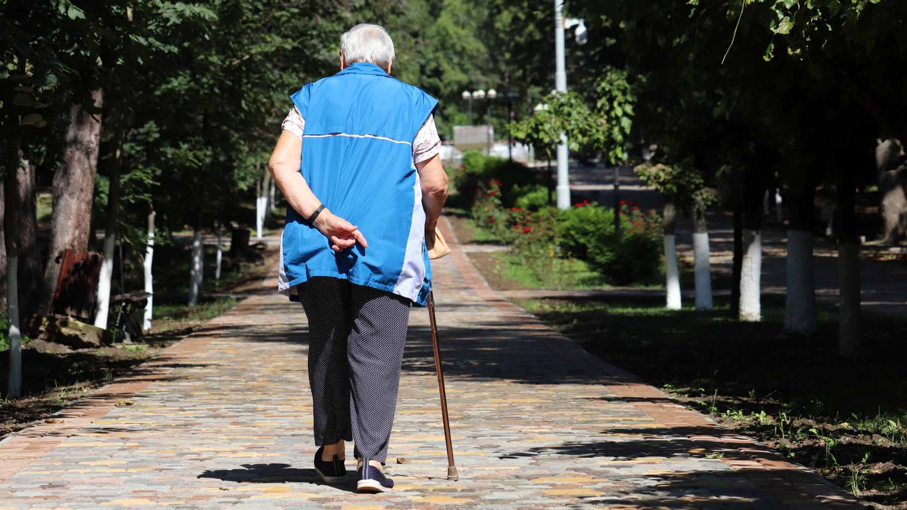 Walking is the top exercise for older adults, but when your neighborhood feels too dangerous to step outside, here is what specialists suggest instead 1 An older adult walking safely inside a climate-controlled indoor space during hot weather conditions.