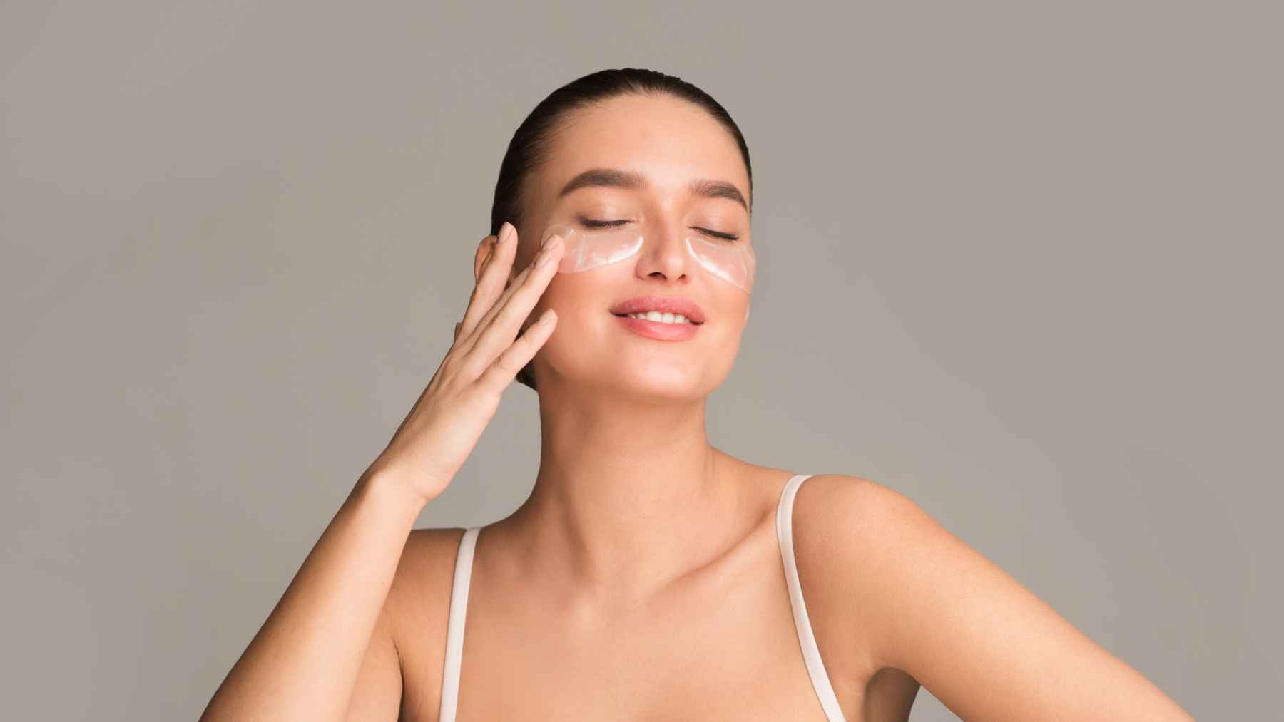 After 40 your body makes less collagen, so the way you take it could decide whether your skin and joints actually feel the difference 1 Woman applying under-eye skincare patches, representing collagen, skin hydration, and elasticity after age 40.