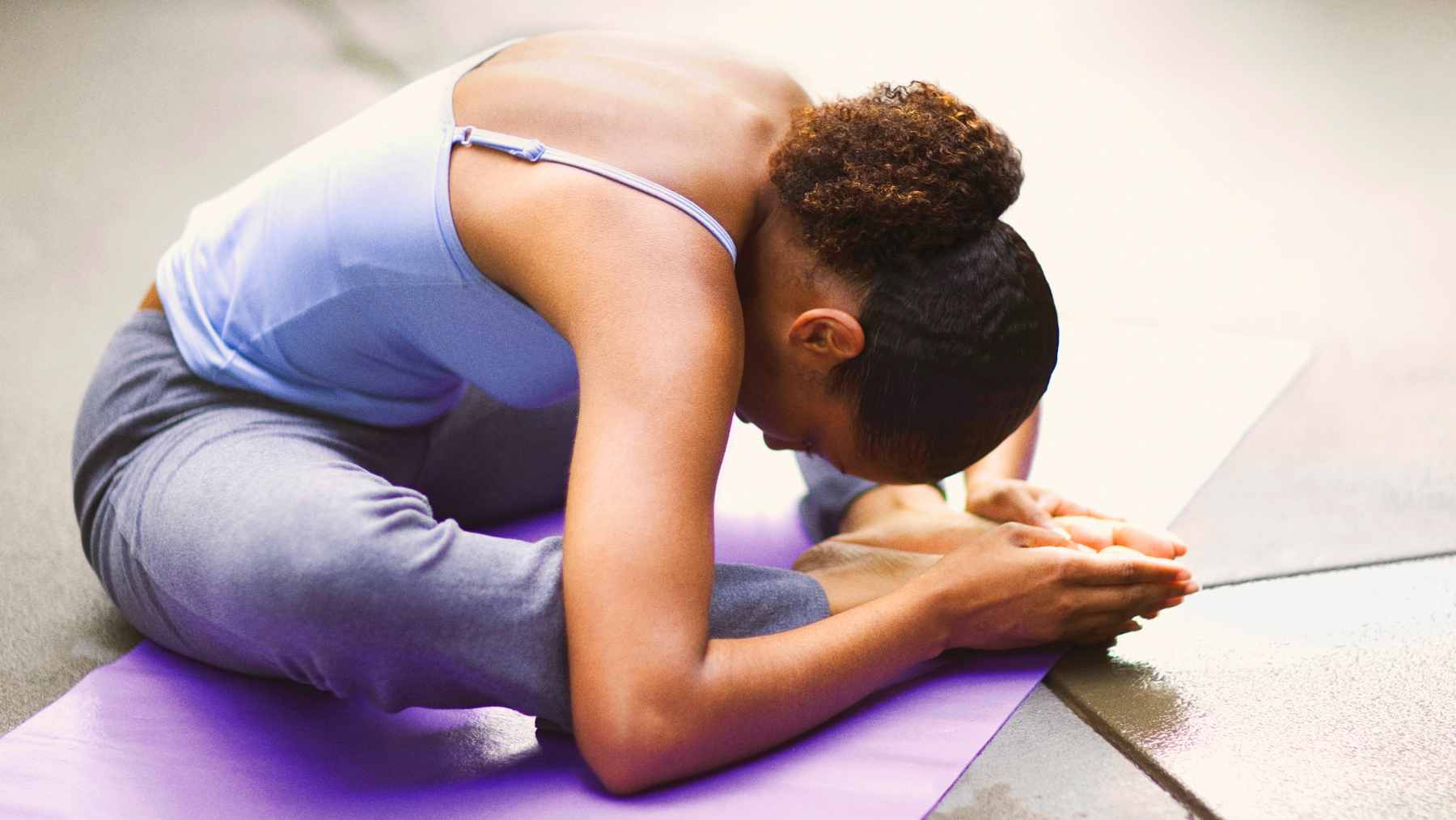 Science says if you survived cancer, this one gentle practice could finally fix your sleep and quiet your anxiety 2 A person participating in a gentle, instructor-led restorative yoga session designed for cancer survivorship and stress management.