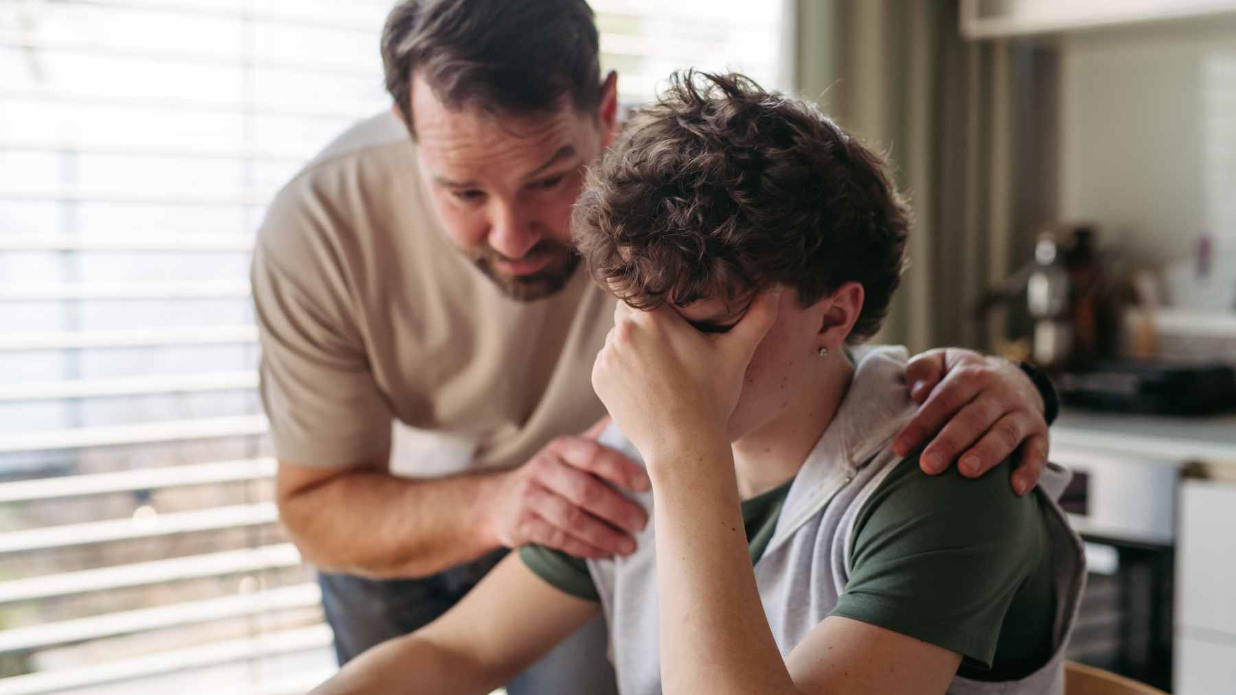 Psychiatrists warn prescriptions for teens are climbing fast, but the reason we all want to fix our problems now runs deeper than you think 1 A medical professional discussing mental health treatment options with a teenager in a clinical setting.