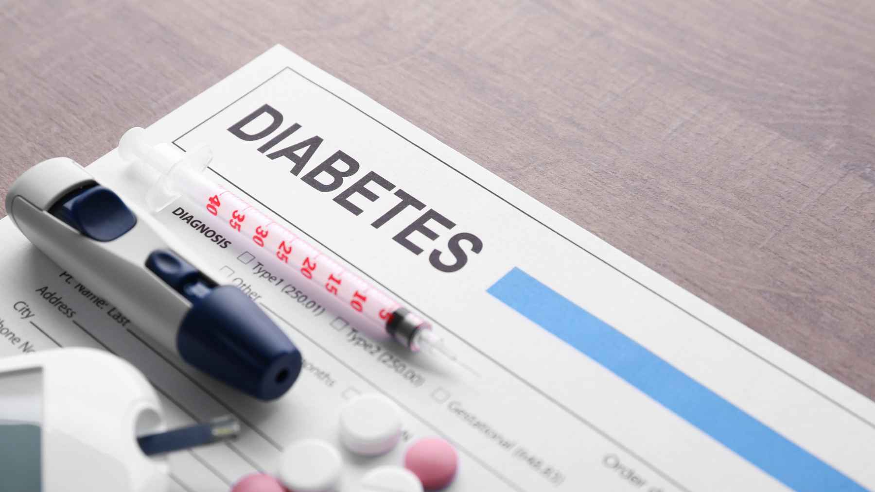New findings suggest diabetes and dementia are linked more closely than you think, and it could change how you protect your brain 1 Insulin syringe, glucose meter, and diabetes diagnosis form illustrating diabetes management and its potential impact on long-term brain health.