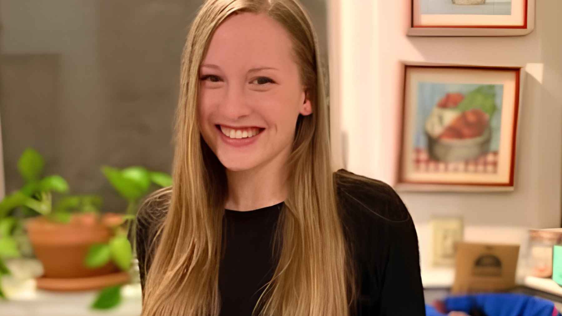 Dietitian standing in a kitchen while preparing ingredients for a healthy Mediterranean-style meal plan