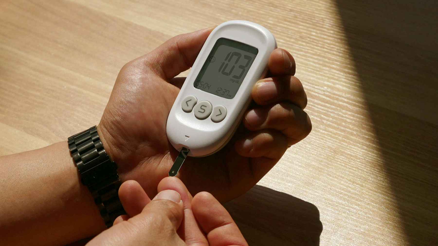 A person walking outdoors in a park, representing healthy daily physical activity and type 2 diabetes prevention.