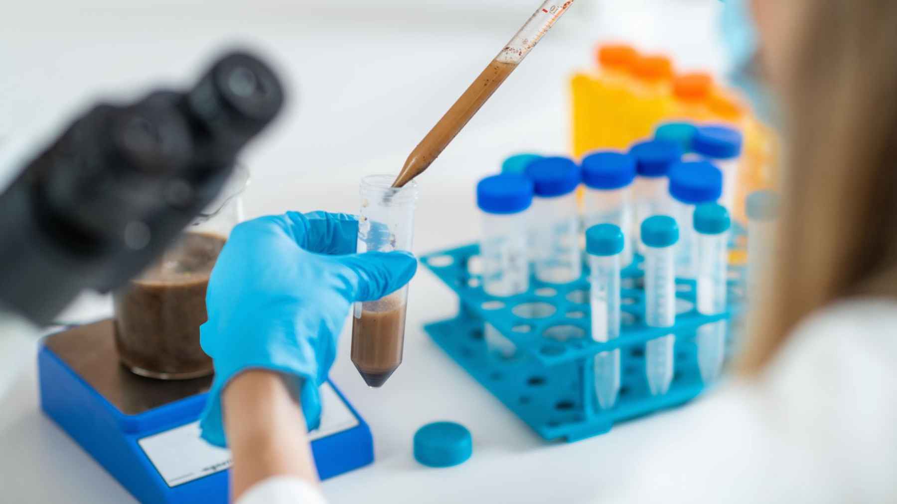 Laboratory researcher prepares a fecal microbiota sample for testing in a study of gut microbes and insomnia