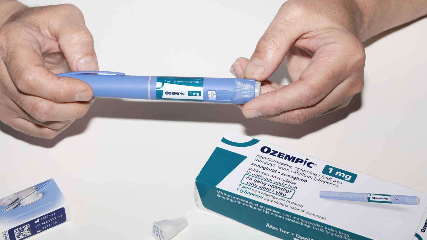 Person using a GLP-1 weight-loss injection as researchers study possible links between the medications and smell or taste disorders.