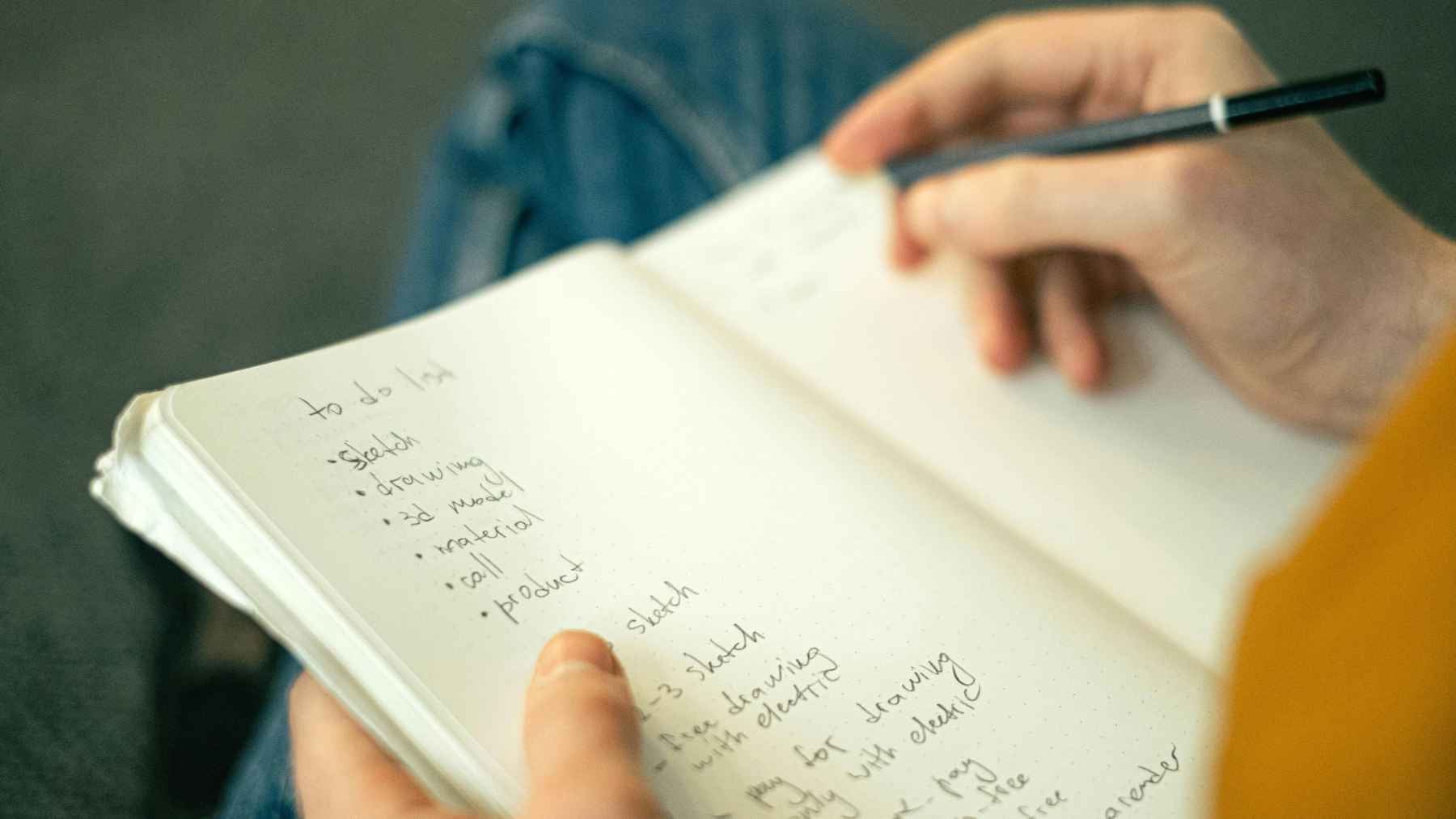 A handwritten note showing mixed uppercase and lowercase letters on a lined piece of paper.