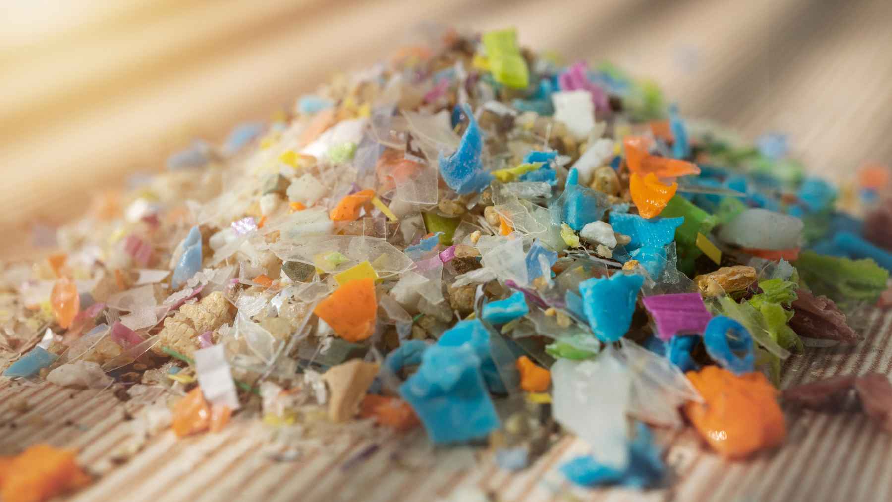 A study found heart attack patients carry more micro and nanoplastics in their blood, and the route those particles take to get there is everyday 1 Medical laboratory equipment analyzing blood samples under a microscope, representing microplastic research.