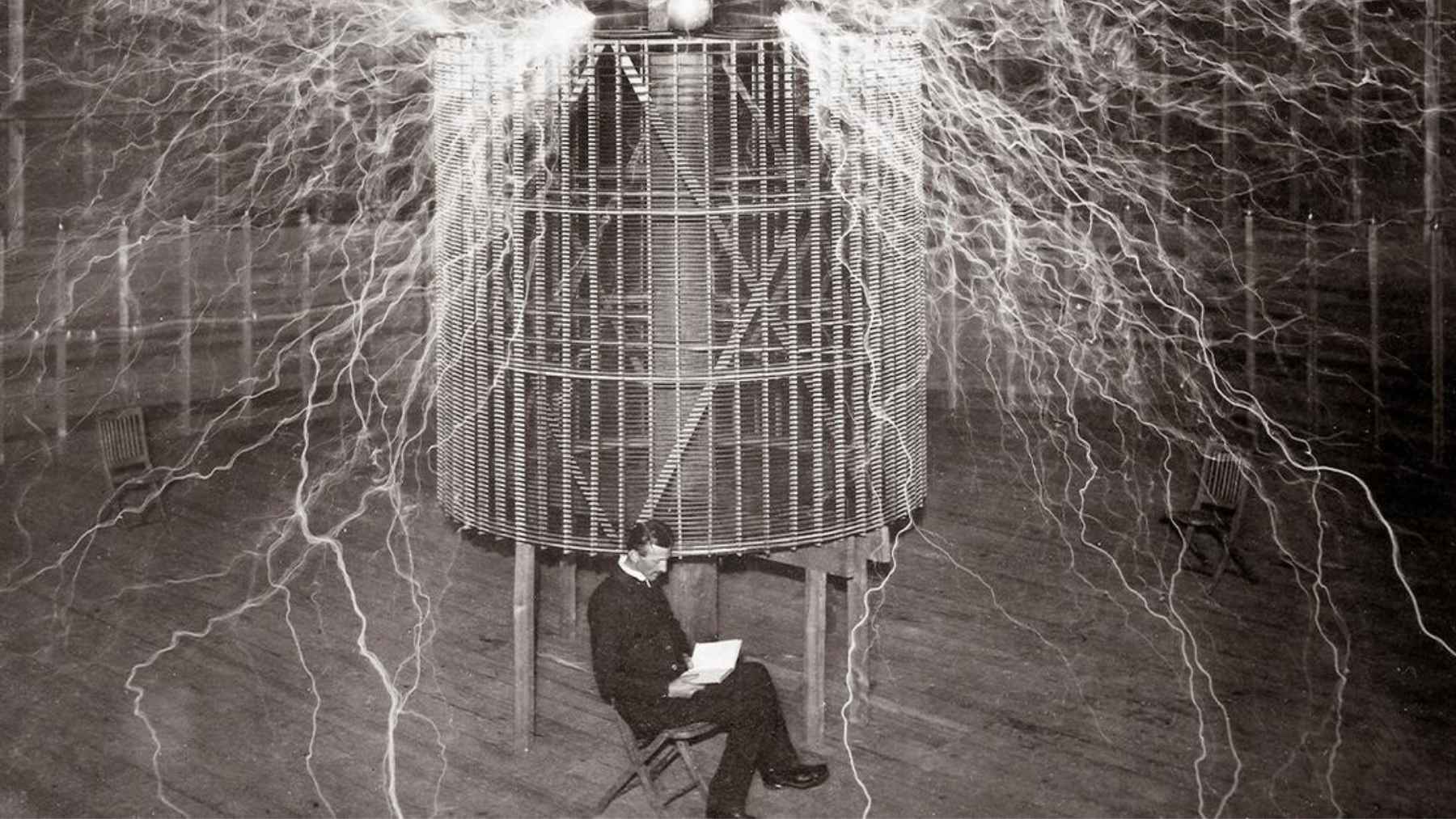 Historic high-voltage electrical experiment with powerful electrical discharges surrounding a large laboratory apparatus