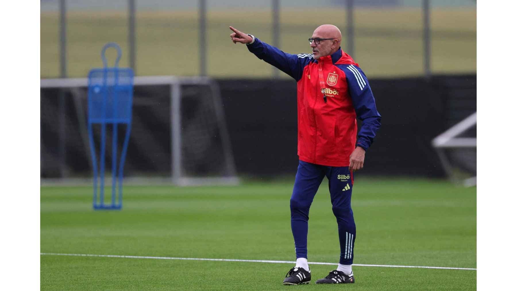 Spain men's national soccer coach Luis de la Fuente directs players during a national team training session.