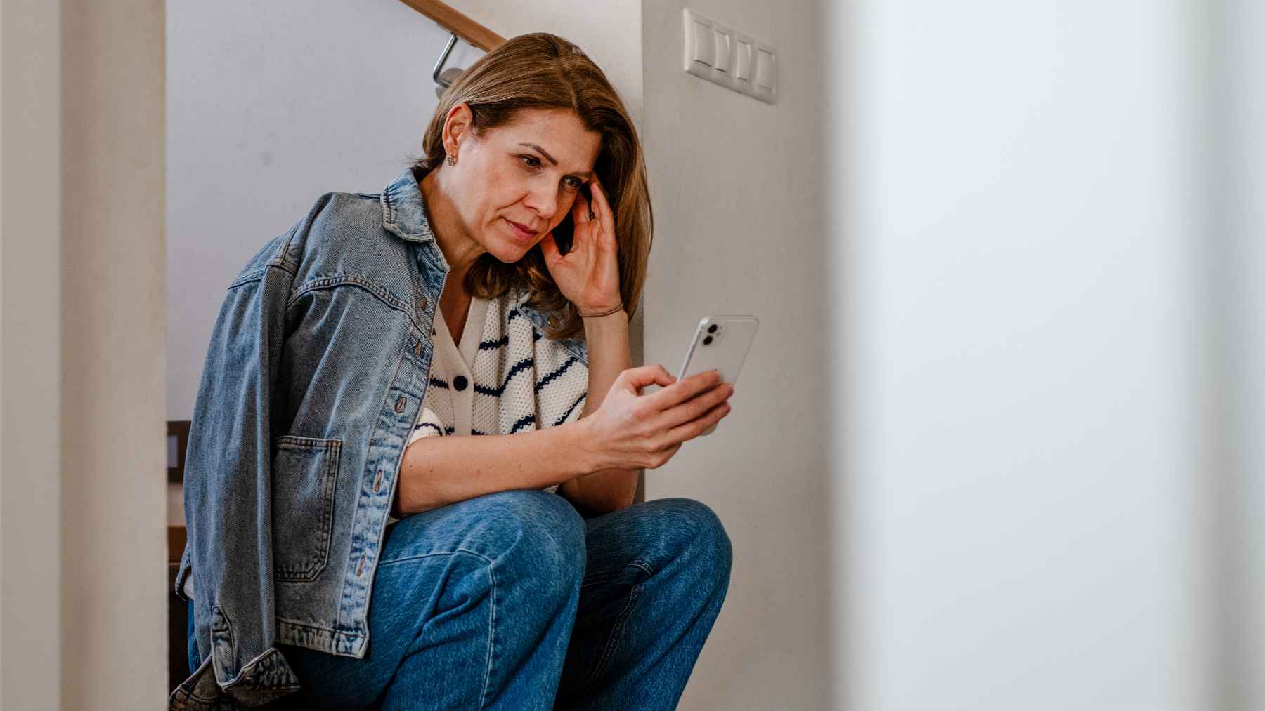 A gynecologist consults with a woman in her 40s about early perimenopause symptoms and progesterone changes.