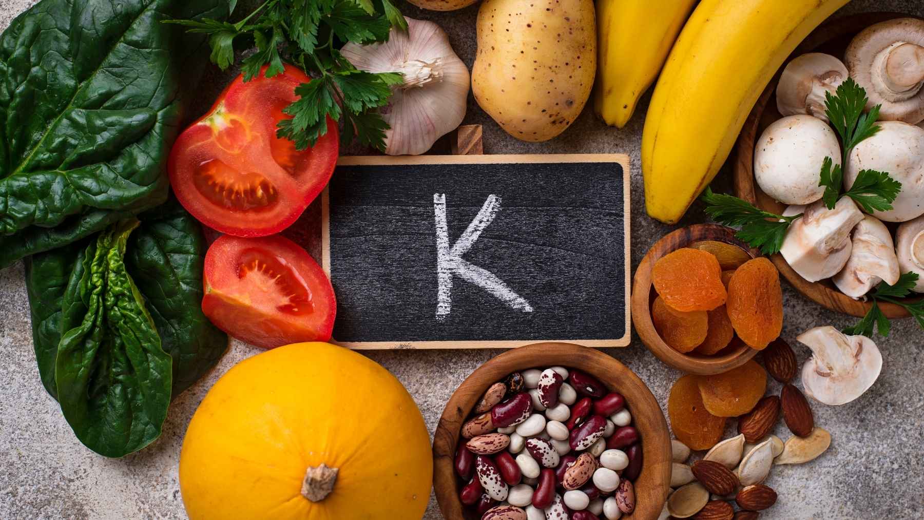 A plate featuring potassium-rich foods like lentils, baked potatoes, and spinach, representing a heart-healthy diet to manage blood pressure.