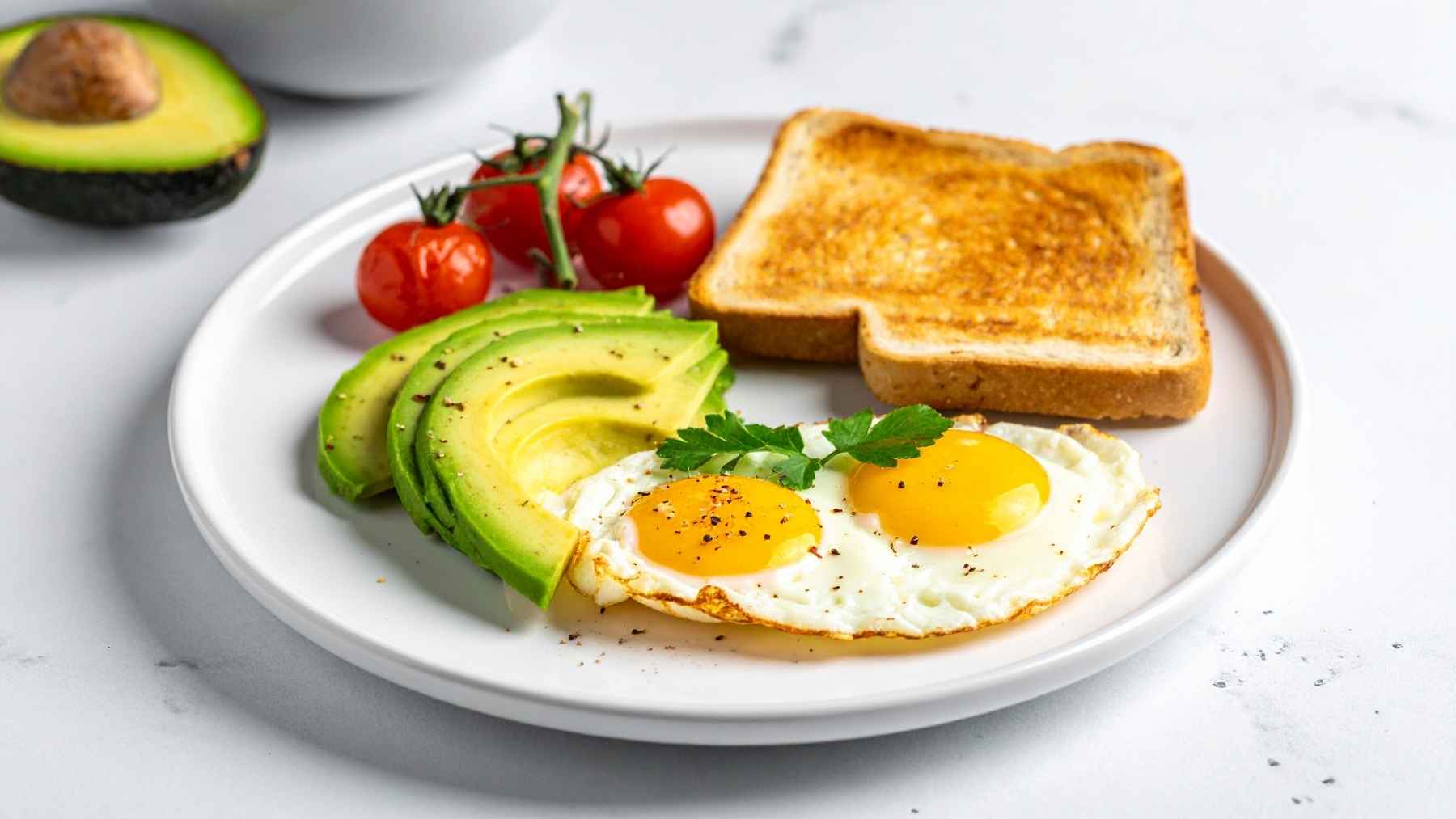 A person preparing a healthy, balanced meal with fresh vegetables and whole foods to support stable blood sugar levels.